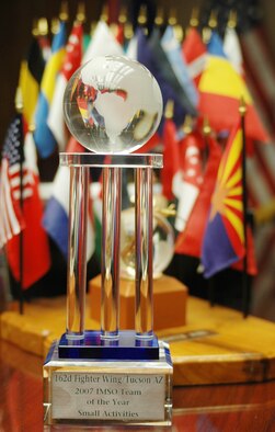 The 162nd Fighter Wing International Military Student Office brings home the 2007 IMSO Team of the Year trophy. The office staff, Lt. Col. Donna Rinehart, Maj. Donna Wolslagel, Senior Master Sgt. Teresa Campbell, Master Sgt. Deb Alegria, Master Sgt. Marnie Neve, Tech. Sgt. Amie Howell and Airman First Class Jonathan Jackson worked around the clock to ensure a smooth training experience for international student pilots here last year.