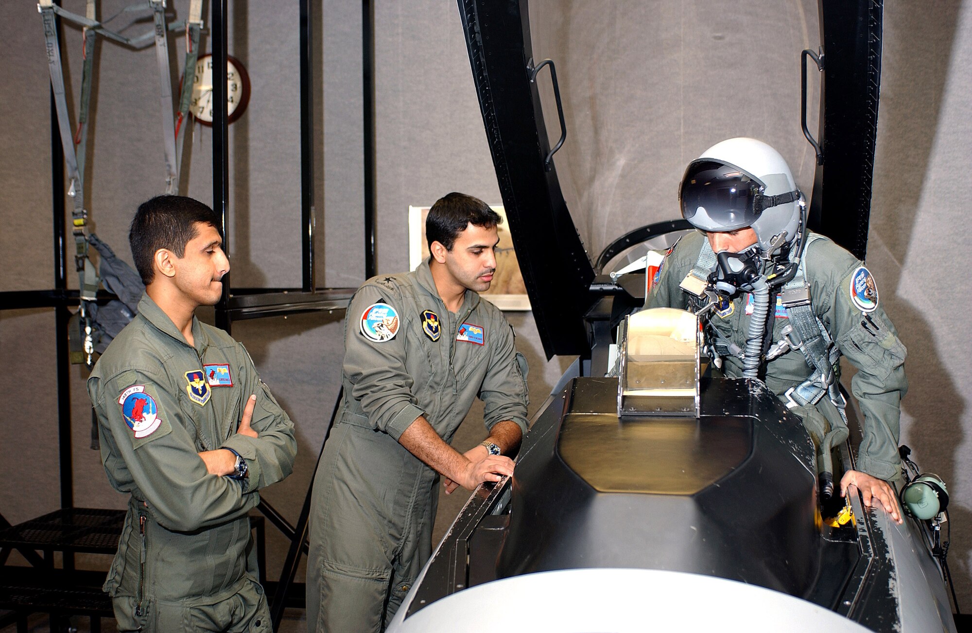 Three student pilots from the United Arab Emirates practice emergency egress procedures Aug. 1 as part of their F-16 Fighting Falcon flight training with the  Arizona Air National Guard's 162nd Fighter Wing in Tucson, Ariz. (U.S. Air Force photo/Master Sgt. Dave Neve)
