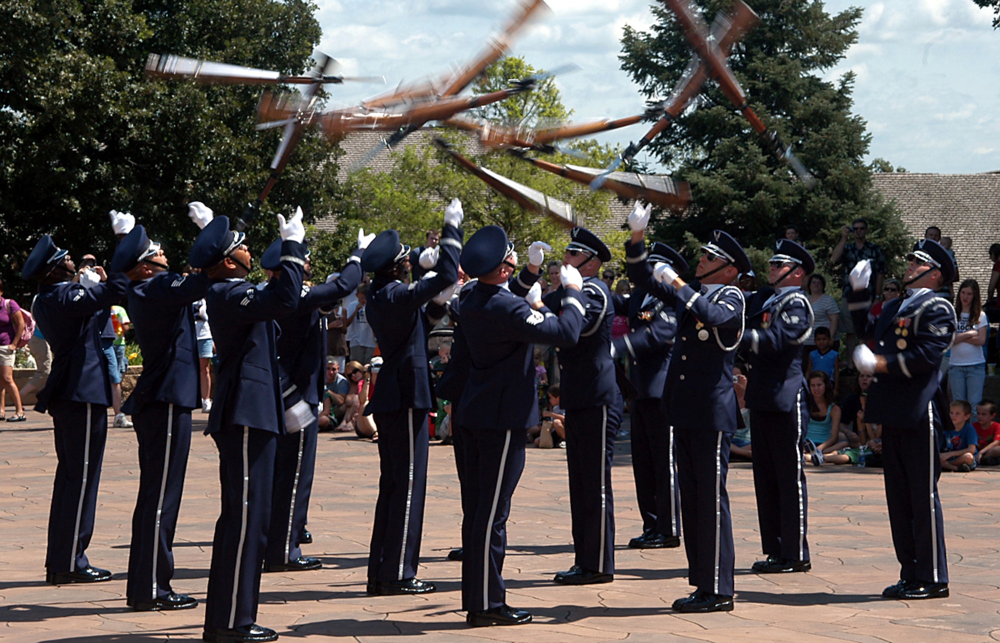 The Air Force Ceremonial Drill Team performs for the crowd at Henry Doorly Zoo in Omaha, Neb., Aug. 12, as a part of Air Force Week activities. The drill team performed several times for the crowd in front of the Do Something Amazing Tour. The zoo also played the IMAX movie “Fighter Pilot: Operation Red Flag,” which set a park attendance record. The Do Something Amazing Tour featured a real F-16, fighter jet, gave visitors the opportunity to try on pilot gear, and to speak with a pilot. (U.S. Air Force photo/Tech. Sgt. David McCarrison)