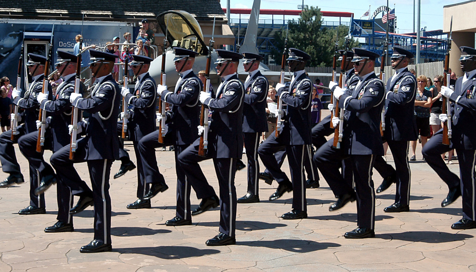 The Air Force Ceremonial Drill Team performs for the crowd at Henry Doorly Zoo in Omaha, Neb., Aug. 12, as a part of Air Force Week activities. The drill team performed several times for the crowd in front of the Do Something Amazing Tour. The zoo also played the IMAX movie “Fighter Pilot: Operation Red Flag,” which set a park attendance record. The Do Something Amazing Tour featured a real F-16, fighter jet, gave visitors the opportunity to try on pilot gear, and to speak with a pilot. (U.S. Air Force photo/Tech. Sgt. David McCarrison)
