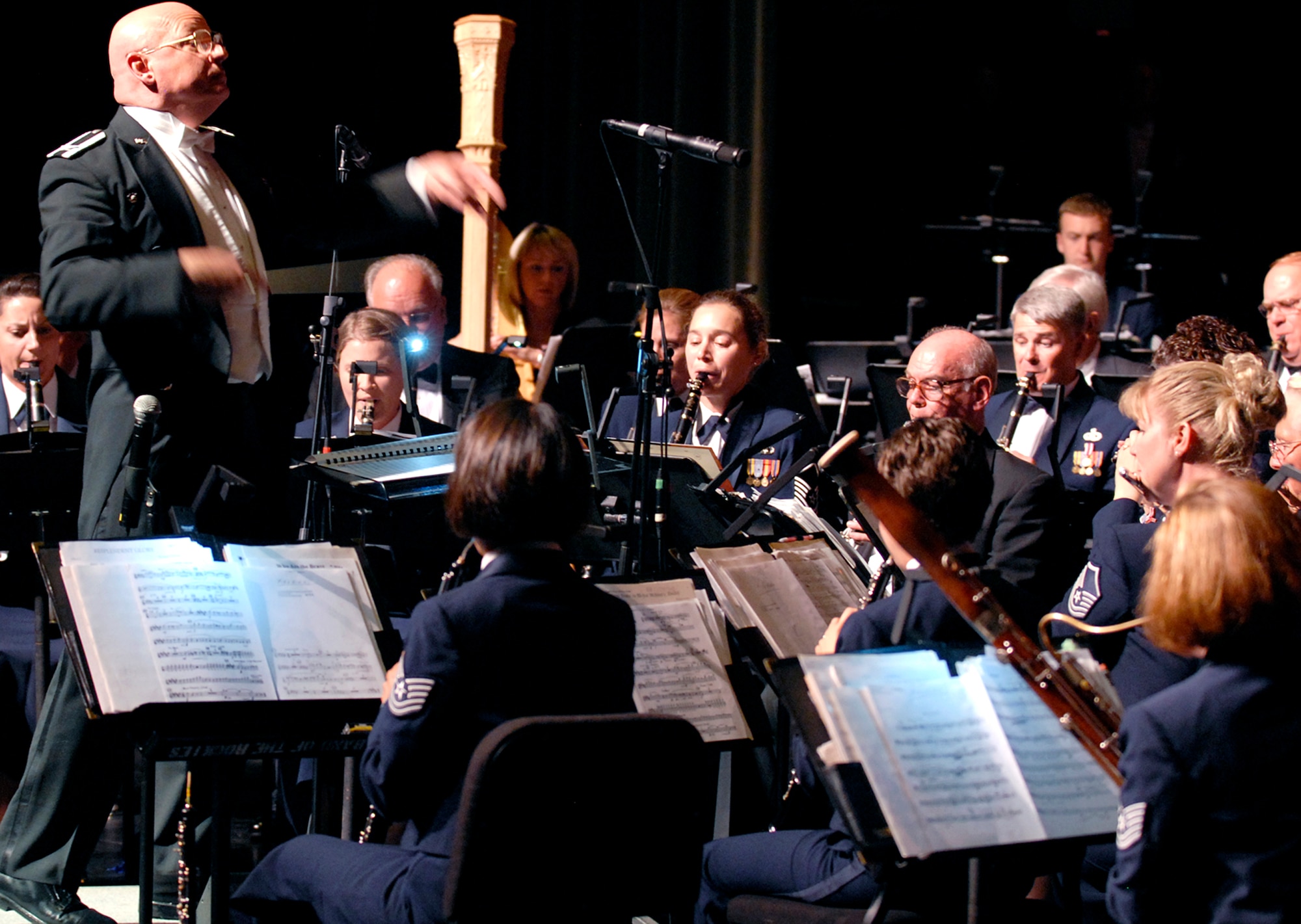 Col. Dennis Layendecker, U.S. Air Force Academy Band commander, conducts his band with grace and style during a performance Aug. 8 at the Pikes Peak Center in Colorado Springs, Colo. The USAFA Band hosted the 2008 Air Force Musicians Association Conference and Reunion Aug. 7-8, sponsoring several events and performances, including vocal, wind and percussion clinics and a "Summertime Favorites" show for attendees. (U.S. Air Force photo/Craig Denton)
