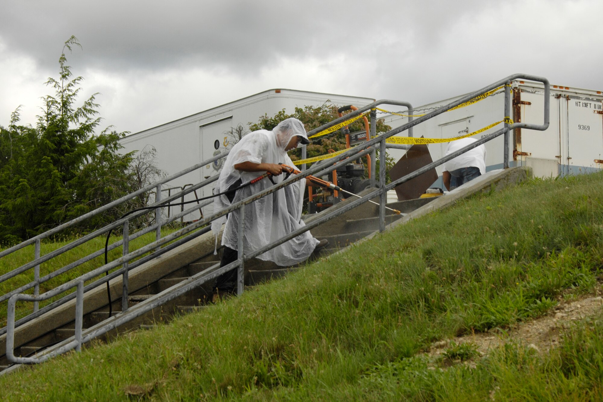 HANSCOM AFB, Mass. – Marcus Brito, Interstate Decorative Concrete Design Corporation, works on cleaning and repairing a concrete stairway near the Air Force Research Laboratory facility on base recently. (U.S. Air Force photo by Linda LaBonte Britt)