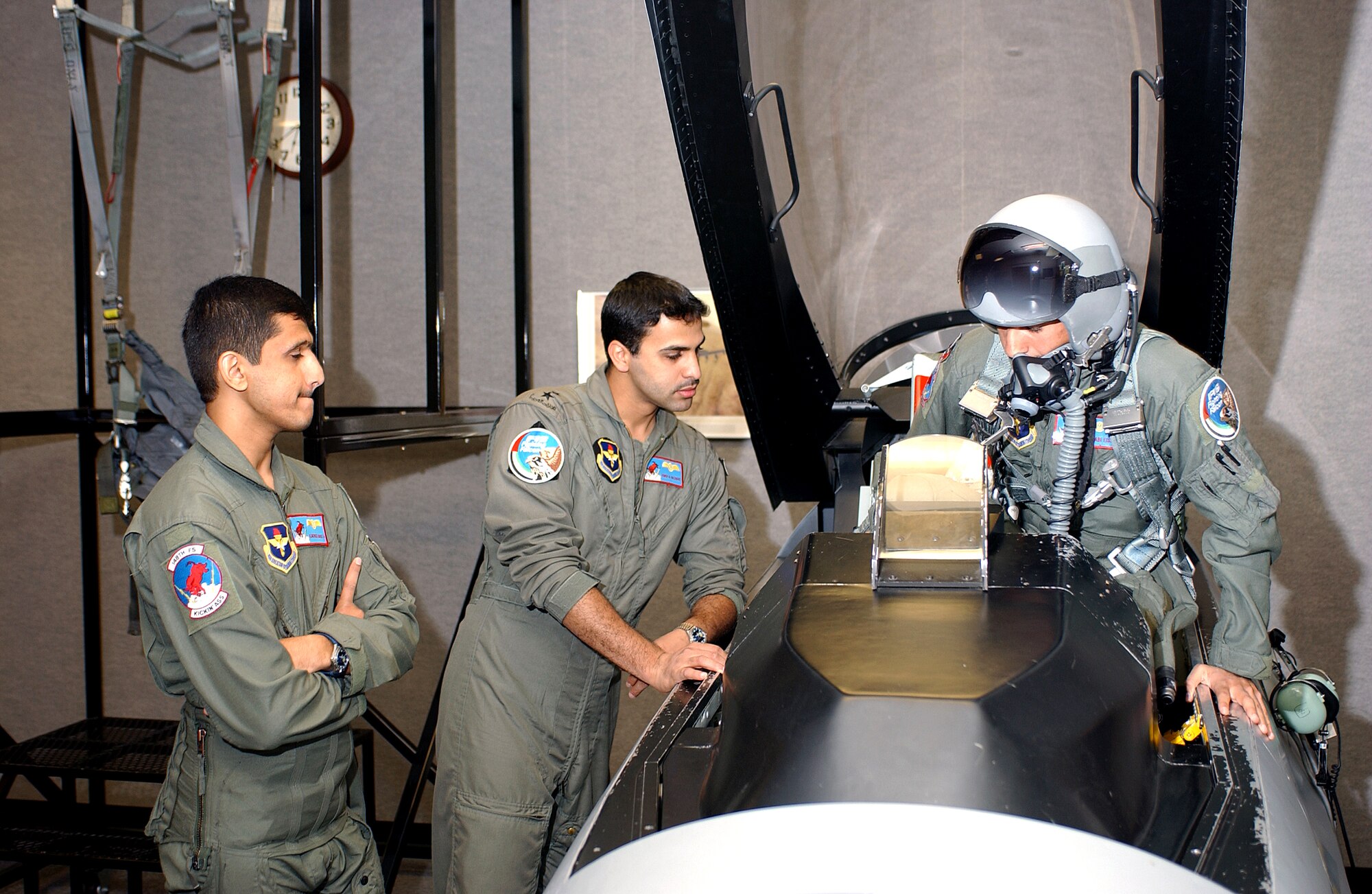 Three student pilots from the United Arab Emirates practice emergency egress procedures as part of their F-16 flight training at the 162nd Fighter Wing in Tucson, Ariz. The Air Guard unit has trained foreign pilots since 1989. (Air National Guard Photo by Master Sgt. Dave Neve)