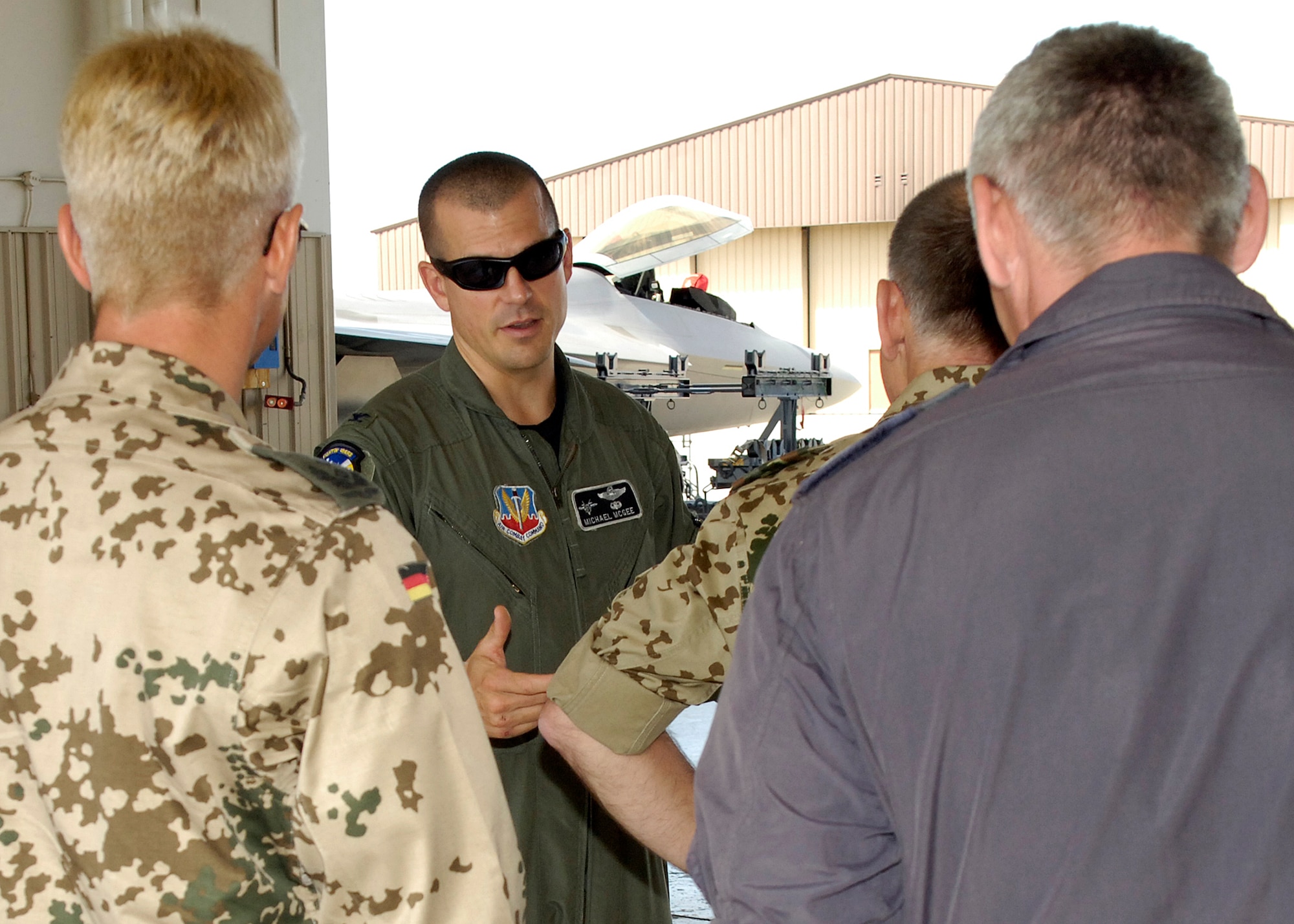Col. Michael McGee, 49th Fighter Wing vice commander, explains characteristics of an F-22A Raptor to Brig. Gen. Gero L.K. Schachthöfer, German Air Force commander German Armed Forces Command United States and Canada, Col. Peter Klement, German Air Force Flying Training Center commander, and Lt. Col. Udo Herrmann, German Air Force, August 13, at Holloman Air Force Base, N.M. General Schachthöfer was visiting Holloman to present the Flight Safety Award to the German Air Force Flying Training Center. (U.S. Air Force photo/Airman 1st Class Michael Means)