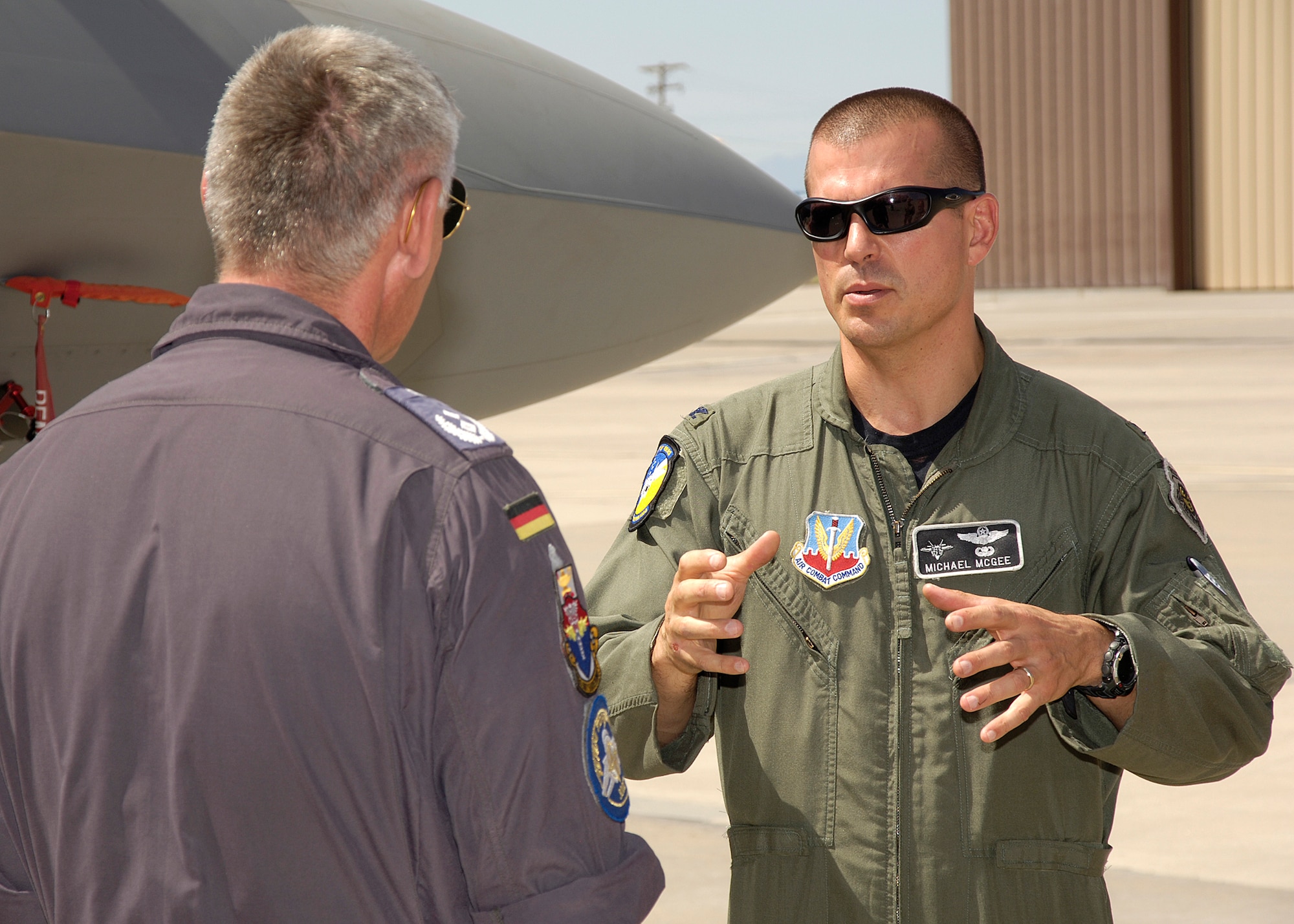 Col. Michael McGee, 49th Fighter Wing vice commander, explains characteristics of an F-22A Raptor to Lt. Col. Udo Herrmann, German Air Force, August 13, at Holloman Air Force Base, N.M. Colonel Herrmann was on a tour with General Schachthöfer, German Air Force commander German Armed Forces Command United States and Canada, visiting Holloman to present the Flight Safety Award to the German Air Force Flying Training Center for five years without a flight accident. (U.S. Air Force photo/Airman 1st Class Michael Means)