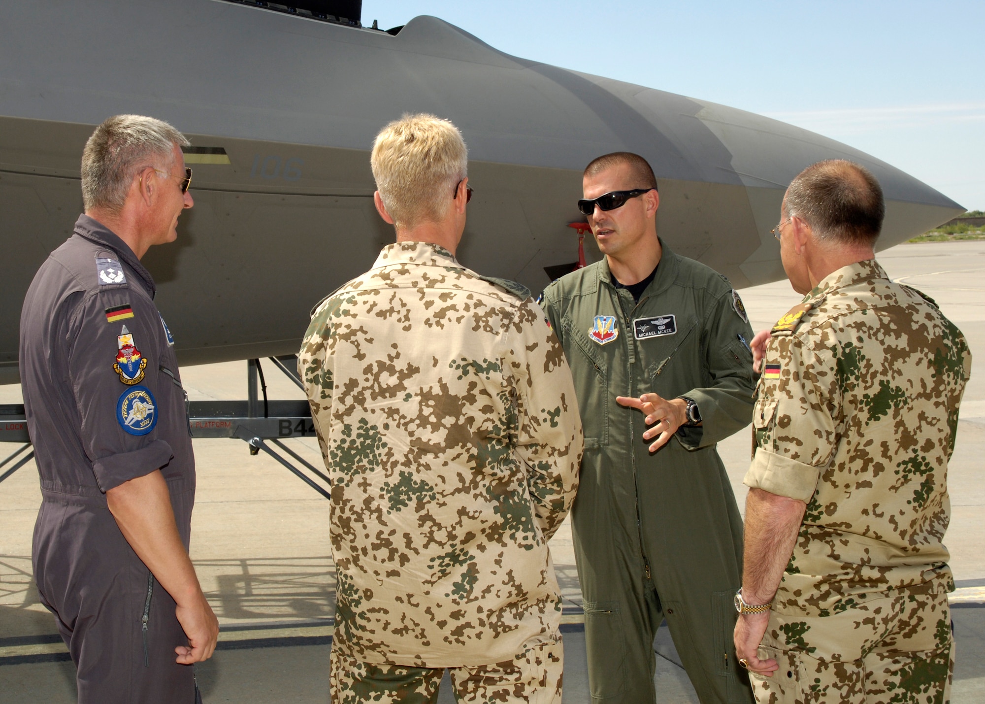 Col. Michael McGee, 49th Fighter Wing vice commander, explains characteristics of an F-22A Raptor to Brig. Gen. Gero L.K. Schachthöfer, German Air Force commander German Armed Forces Command United States and Canada, Col. Peter Klement, German Air Force Flying Training Center commander, and Lt. Col. Udo Herrmann, German Air Force, August 13, at Holloman Air Force Base, N.M. General Schachthöfer was visiting Holloman to present the Flight Safety Award to the German Air Force Flying Training Center for five years without a flight accident. (U.S. Air Force photo/Airman 1st Class Michael Means)