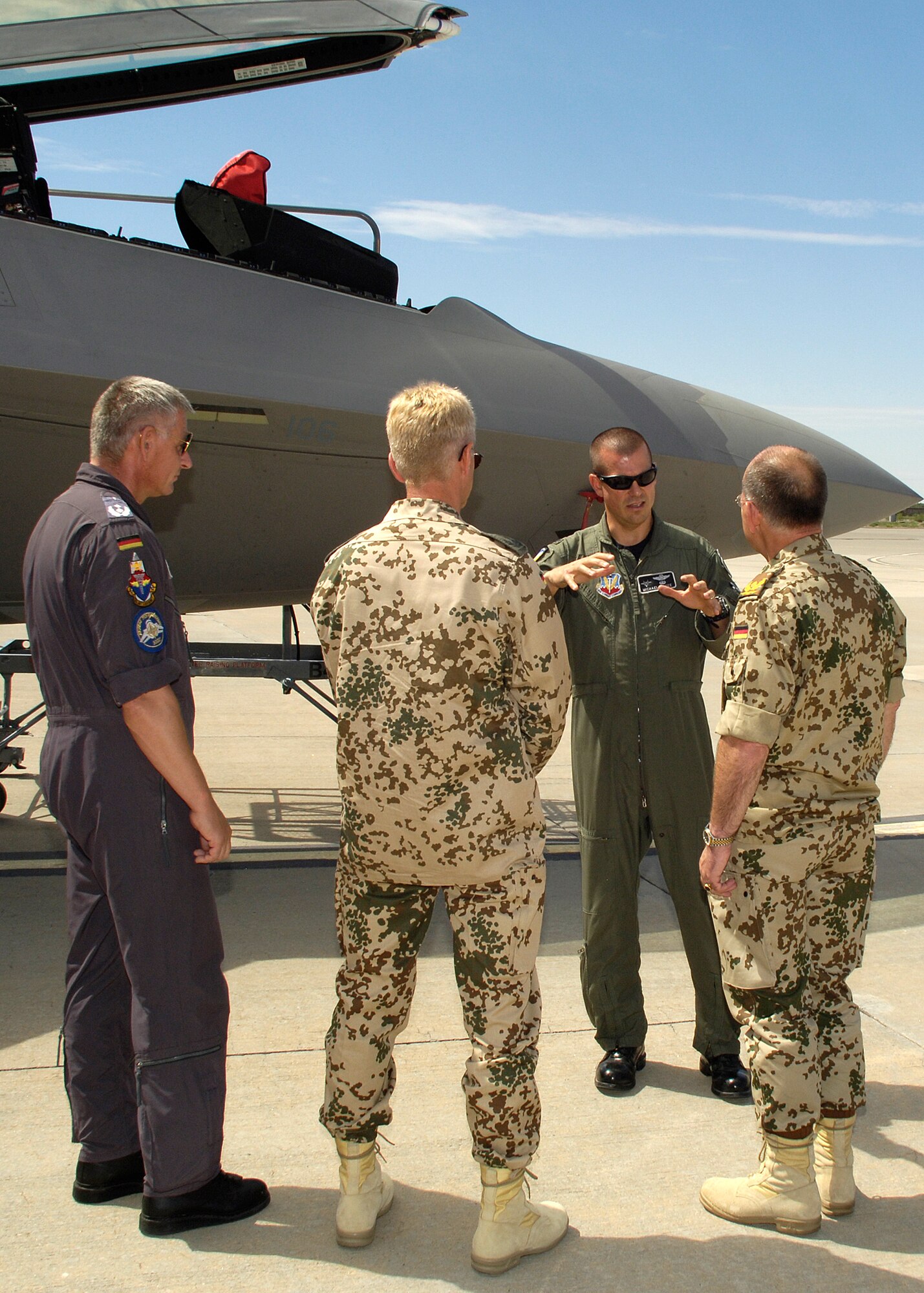 Col. Michael McGee, 49th Fighter Wing vice commander, explains characteristics of an F-22A Raptor to Brig. Gen. Gero L.K. Schachthöfer, German Air Force commander German Armed Forces Command United States and Canada, Col. Peter Klement, German Air Force Flying Training Center commander, and Lt. Col. Udo Herrmann, German Air Force, August 13, at Holloman Air Force Base, N.M. General Schachthöfer was visiting Holloman to present the Flight Safety Award to the German Air Force Flying Training Center for five years without a flight accident. (U.S. Air Force photo/Airman 1st Class Michael Means)