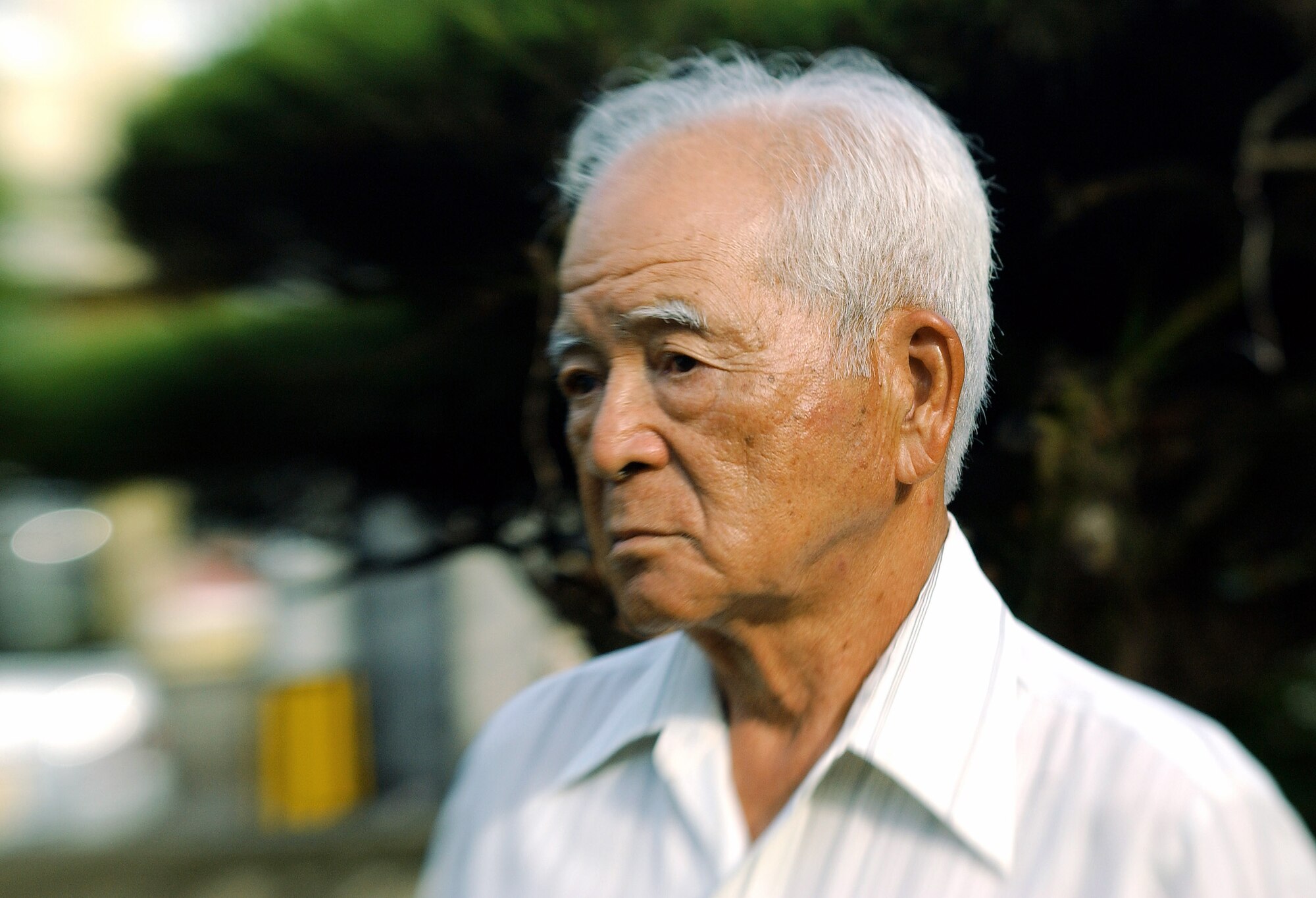 Eiichiro Shimabukuro, 77 years old, recalls the aftermath of World War II when the U.S. military worked with Okinawans to rebuild the island's devastated infrastructure and return life to normalcy, during an interview Aug. 12. Mr. Shimabukuro has worked and volunteered at the Kadena Air Base, Japan, clinic since 1950 and was the first Okinawan hired to work there. (U.S. Air Force photo/Tech. Sgt. Rey Ramon)