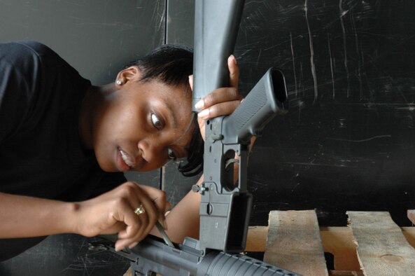 MCGUIRE AIR FORCE BASE, N.J. -- Airman 1st Class Tanile Burns is one of a handful of Air Force Reserve volunteers who recently cleaned close to a thousand weapons within one week. The mass cleaning was in part due to an annual requirement as well as partly due to preparation for an upcoming operational readiness inspection. (U.S. Air Force photo/Senior Airman William P. O'Neil, III) 