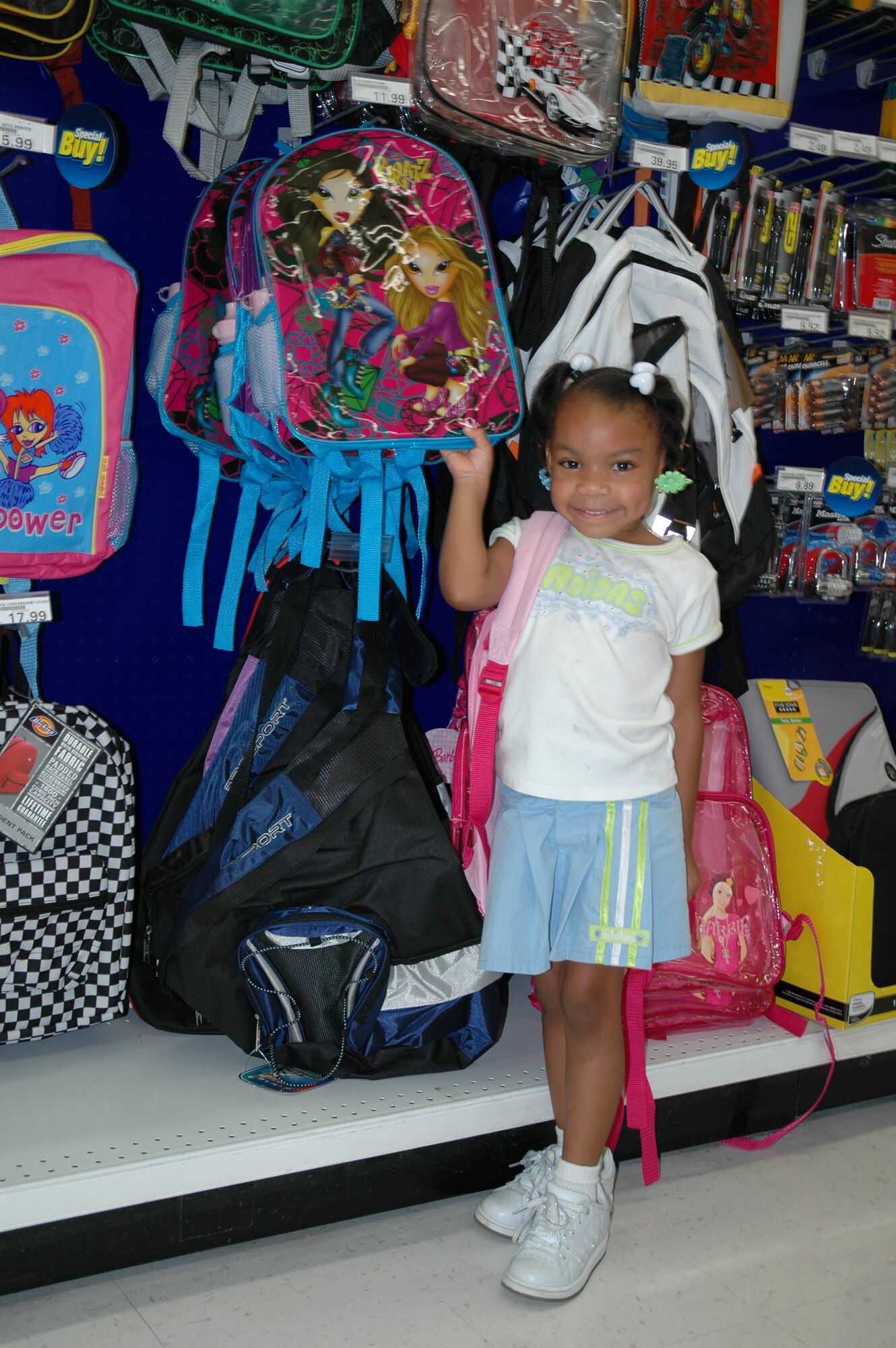 With school starting Monday for most Brevard County students, Matyce Tapper, 4-years old and starting pre-school, shows off the new backpack she picked up at the Patrick BX last week. AAFES officials want to remind shoppers that they have many discounted items at the store, to include lunch boxes, backpacks, shoes and more. “AAFES’ buying staff has done its homework over the past year and we’re ready to pass the savings lessons on to authorized shoppers,” said the exchange’s Teo Smith, General Manager. “Even though we’ve crammed to deliver the best ‘back to school’ shopping experience possible, we’re always prepared to match the lowest local price to ensure military Families are getting the best value for their ‘back to school’ dollars.” (U.S. Air Force photo by Airman 1st Class David Dobrydney)