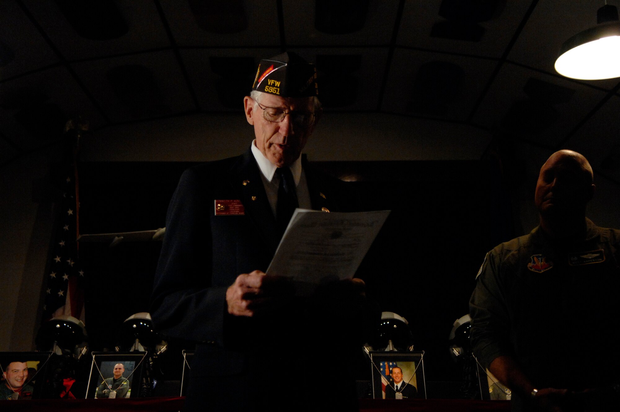 BARKSDALE AIR FORCE BASE, La. -- Kenneth Koval, Veterans of Foreign Wars member, reads a dedication to the crew members of Raider 21 during a presentation at the Eighth Air Force Museum here Aug. 12. (U.S. Air Force photo by Airman 1st Class Joanna M. Kresge)