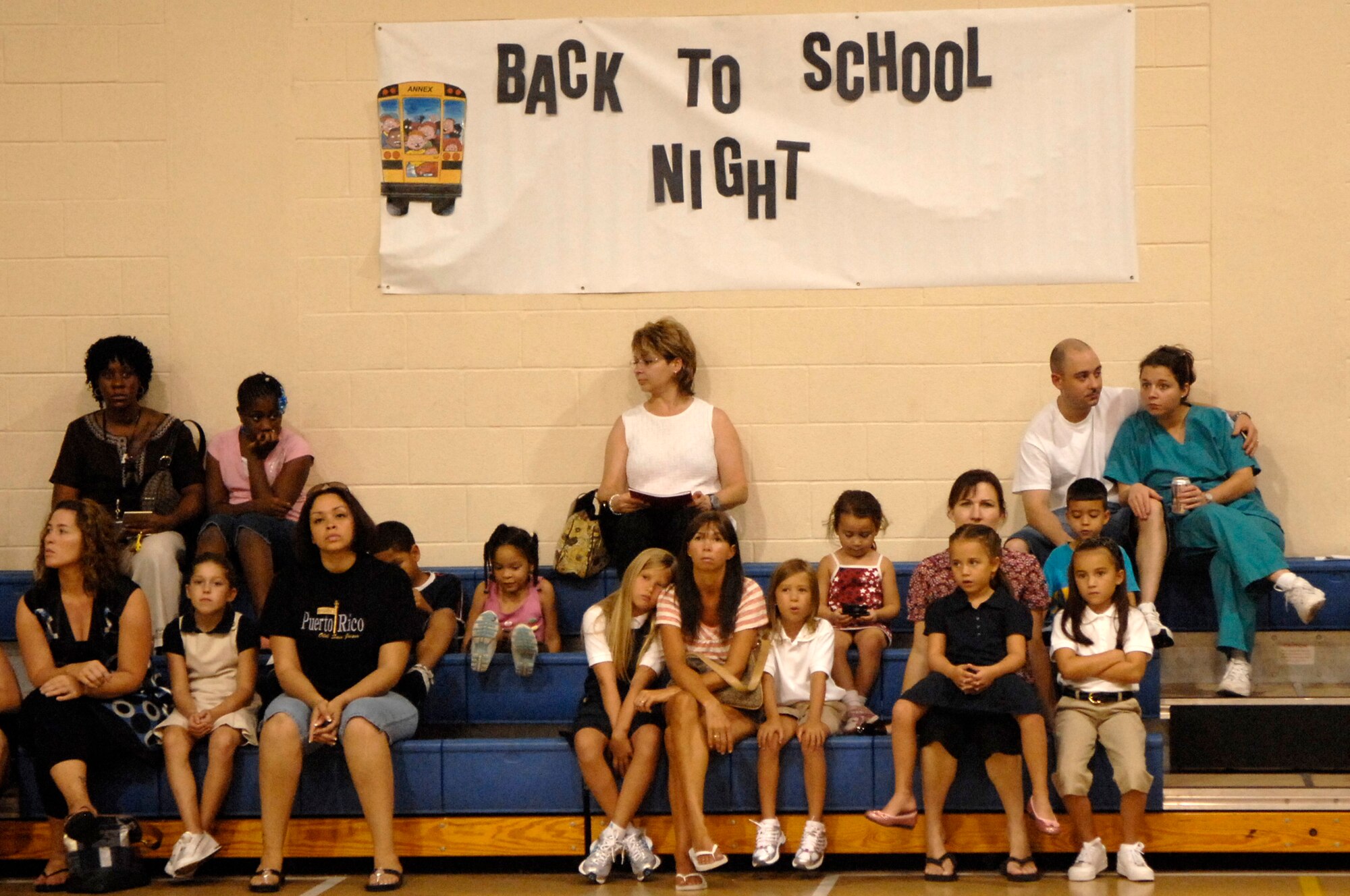 BARKSDALE AIR FORCE BASE, La. - Parents and children listen to opening remarks during a back to school event held at the youth center here July 31. (U.S. Air Force photo by Airman 1st Class Joanna M. Kresge)