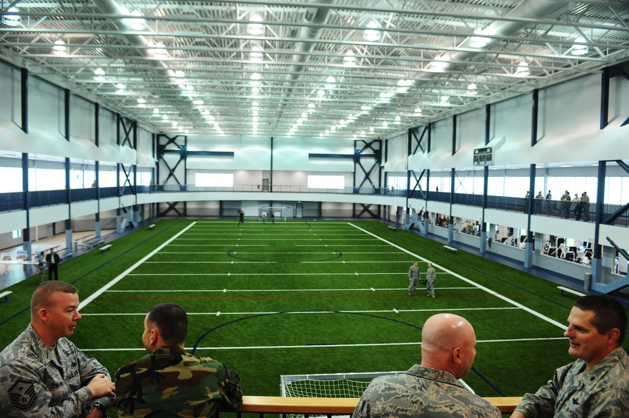 Many Airmen explore the new fitness center addition during the official grand opening ceremony Aug. 13, 2008, at Eielson Air Force Base, Alaska. The new addition has an indoor track and field, lifting equipment rooms along with Health and Wellness Center classrooms. (U.S. Air Force photo by Airman 1st Class Jonathan Snyder)