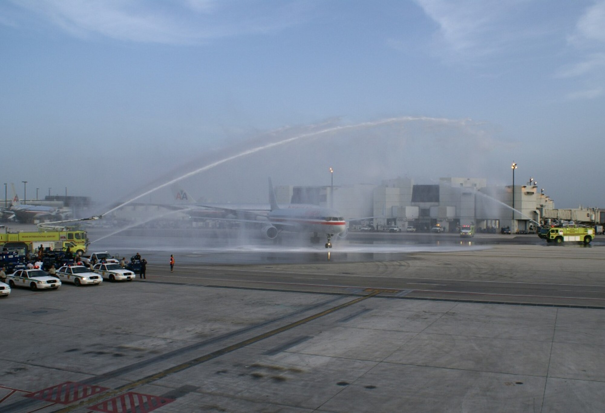 Thirty-six Defenders from the 482nd Security Forces Squadron returned home to a water cannon salute at Miami International Airport Wednesday evening after completing a six-month deployment to Kirkuk Regional Air Base, Iraq. The reservists maintained a safe and secure environment for thousands of U.S., Coalition and Iraqi troops, U.S. State Department Provisional Reconstruction Teams, and civilian contractors housed and operating from the base. (U.S. Air Force photo/Staff Sgt. Erik Hofmeyer)