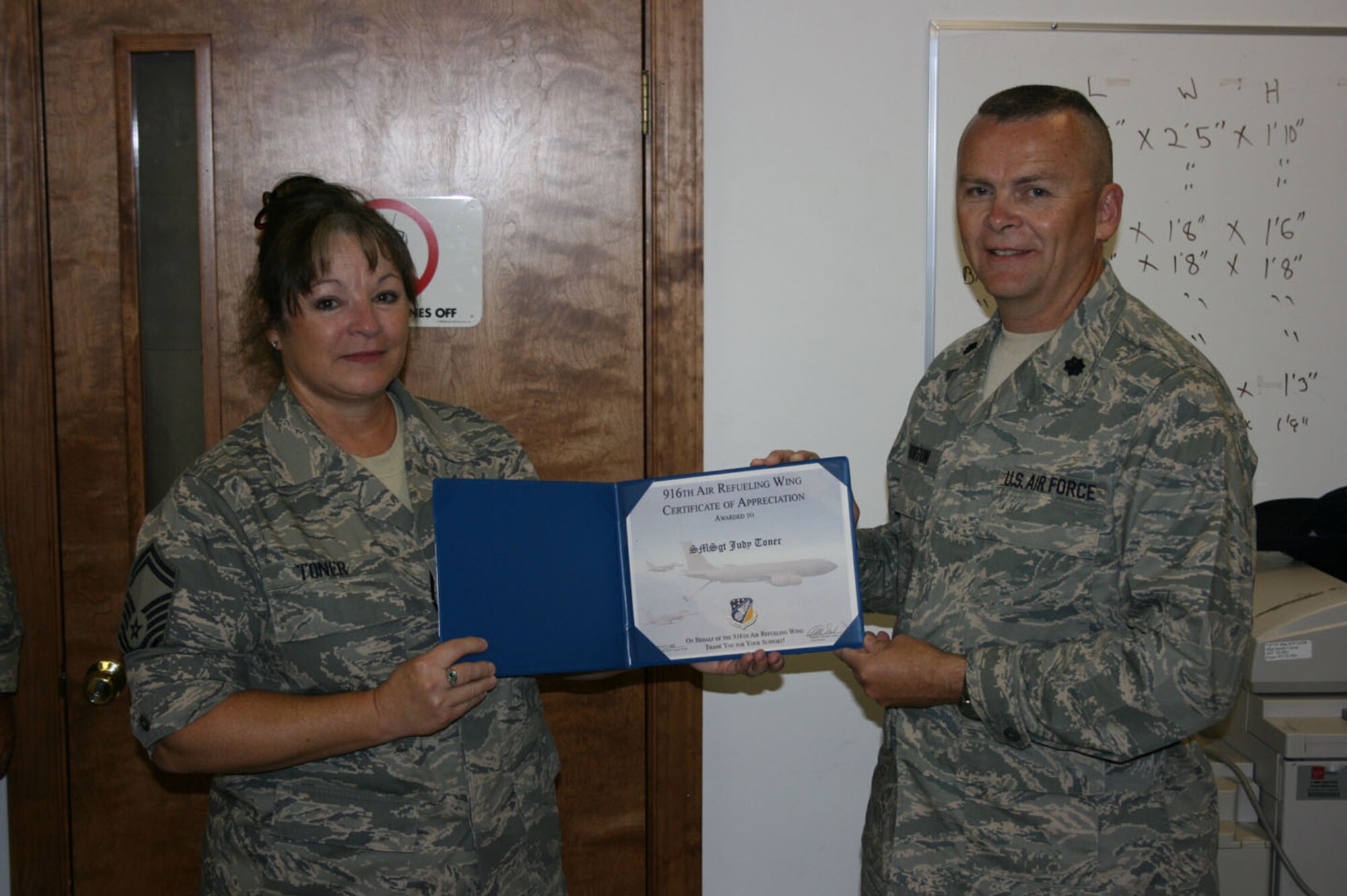 SEYMOUR JOHNSON AIR FORCE BASE, N.C. -- Senior Master Sgt. Judy Toner (left) receives the Get One Certificate of Appreciation from her commander, Lt. Col. James Horton. Sgt. Toner received the recruiting award for her efforts with assisting the 916th Air Refueling Wing recruiting program. Sgt. Toner is assigned to the 916th Communications Squadron.