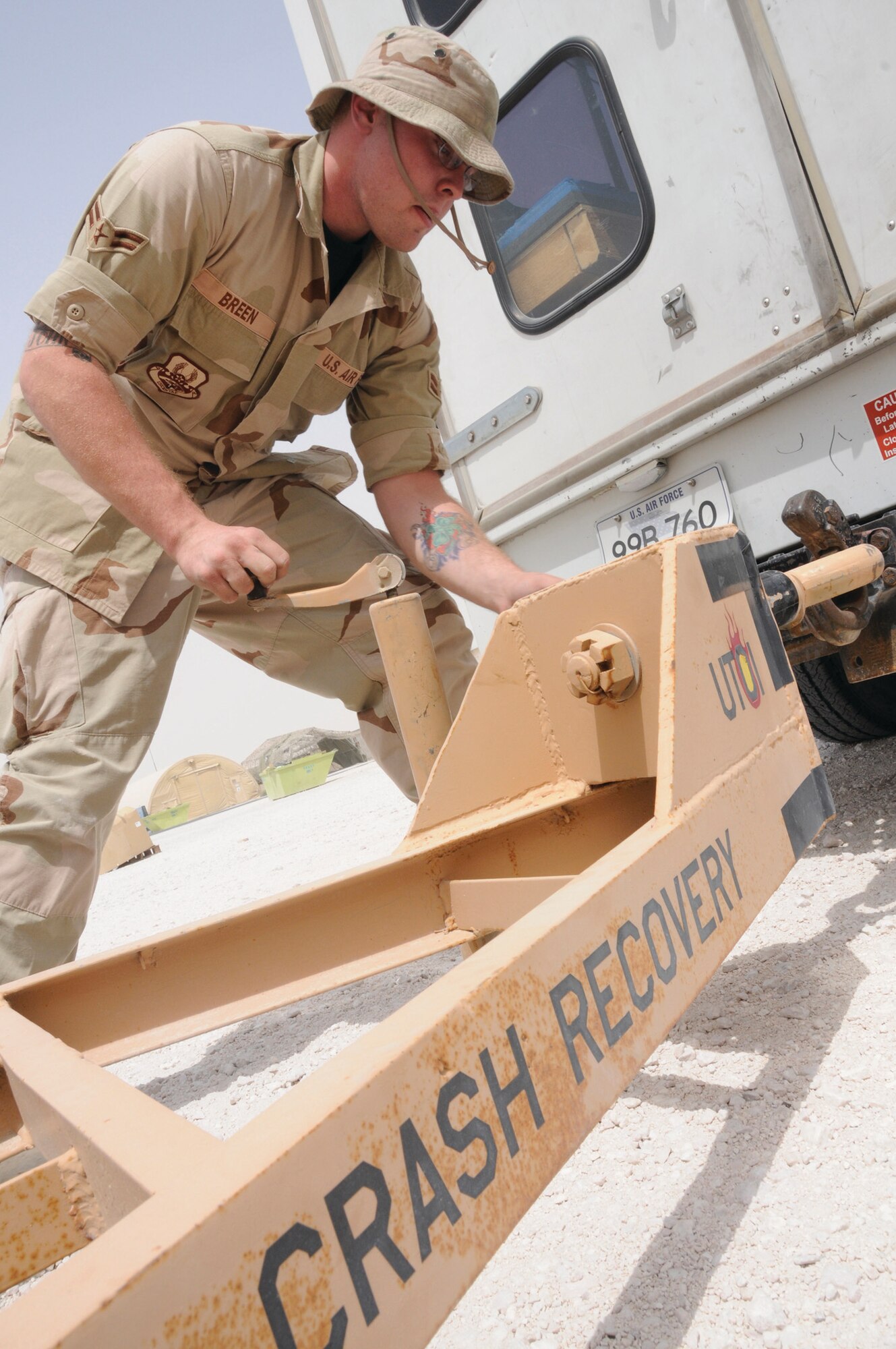 Airman 1st Class Daniel Breen, repair and reclamation journeyman with the 379th Expeditionary Maintenance Squadron, connects the Recovery 4 van to a jack trailer Aug. 14, 2008, at an undisclosed air base in Southwest Asia. The 379th Expeditionary Maintenance Squadron is responsible for recovering aircraft and clearing the debris of crashed aircraft throughout the U.S. Central Command’s area of responsibility. Airman Breen, a native of Alliance, Neb., is deployed from Grand forks Air Force Base, N.D., and Airman Saari, a native of Las Vegas, Nev., is deployed from Ellsworth Air Force Base, S.D., in support of Operations Iraqi Freedom, Enduring Freedom and Joint Task Force-Horn of Africa. (U.S. Air Force photo by Staff Sgt. Darnell T. Cannady)