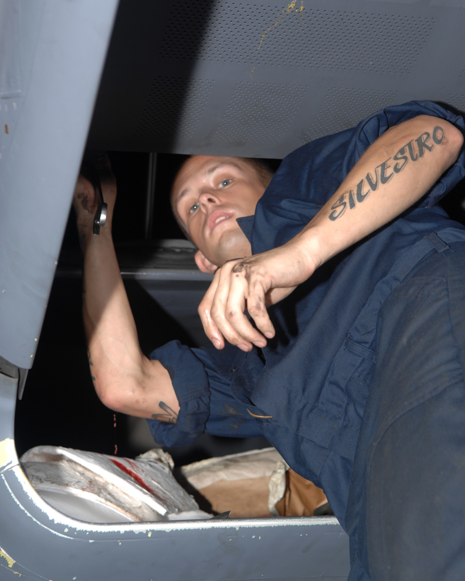 ANDERSEN AIR FORCE BASE, Guam - Senior Airman Frank Sylvester, 389th Expeditionary Aircraft Maintenance Squadron, performs maintenance on an F-15E Strike Eagle during its phase maintenance Aug. 14. A phase inspection is a group of maintenance squadron flights working together towards a common goal, which is the completion of the inspection. A phase inspection is a miniature overhaul for the aircraft that is performed every 400 flight hours. (U.S. Air Force photo by Airman 1st Class Cory Todd)
