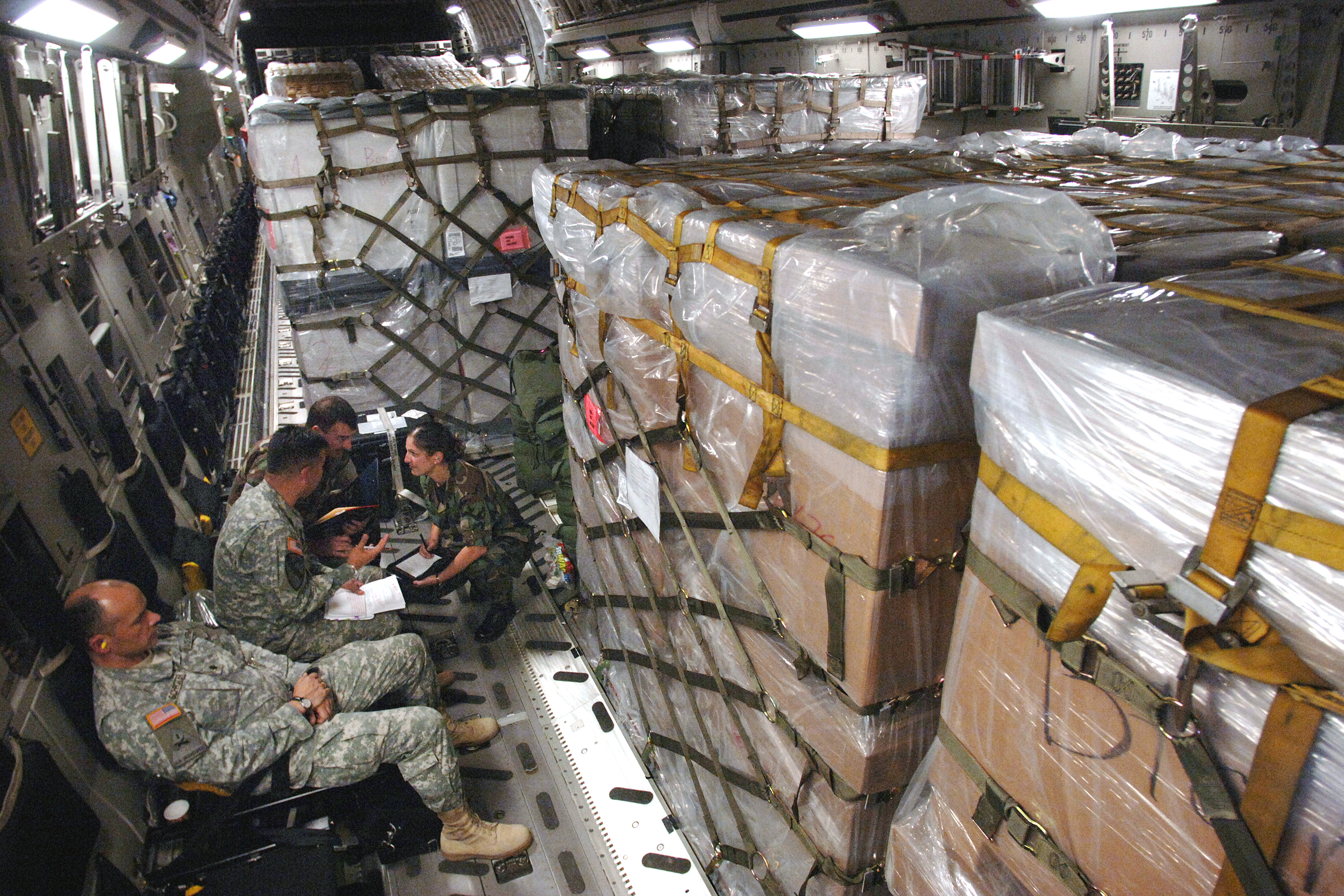 U.S. Army Navy and Air Force officers discuss details of the