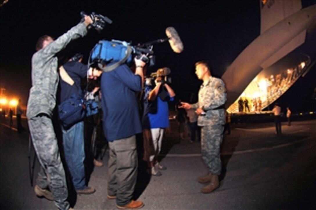 U.S. Army Col. Benjamin Eversen, chief of the International Operations Division for U.S. Army Europe, briefs the international press on the first delivery of 16 pallets for the people of Georgia from Ramstein Air Base, Aug. 13, 2008. 