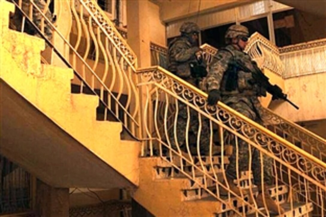 U.S. Army Military Police assess the potential renovation of a vocational school in the Sadr City district of Baghdad, Iraq, Aug. 10, 2008. The soldiers are assigned to the 4th Infantry Division. 
