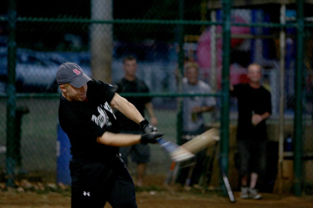 Jason Schachette, Provost Marshall's Office Law Dawgs' right centerfielder cracks into a ball, during the 2008 Intramural Softball League quarter final playoff game at Annex field Aug. 15.