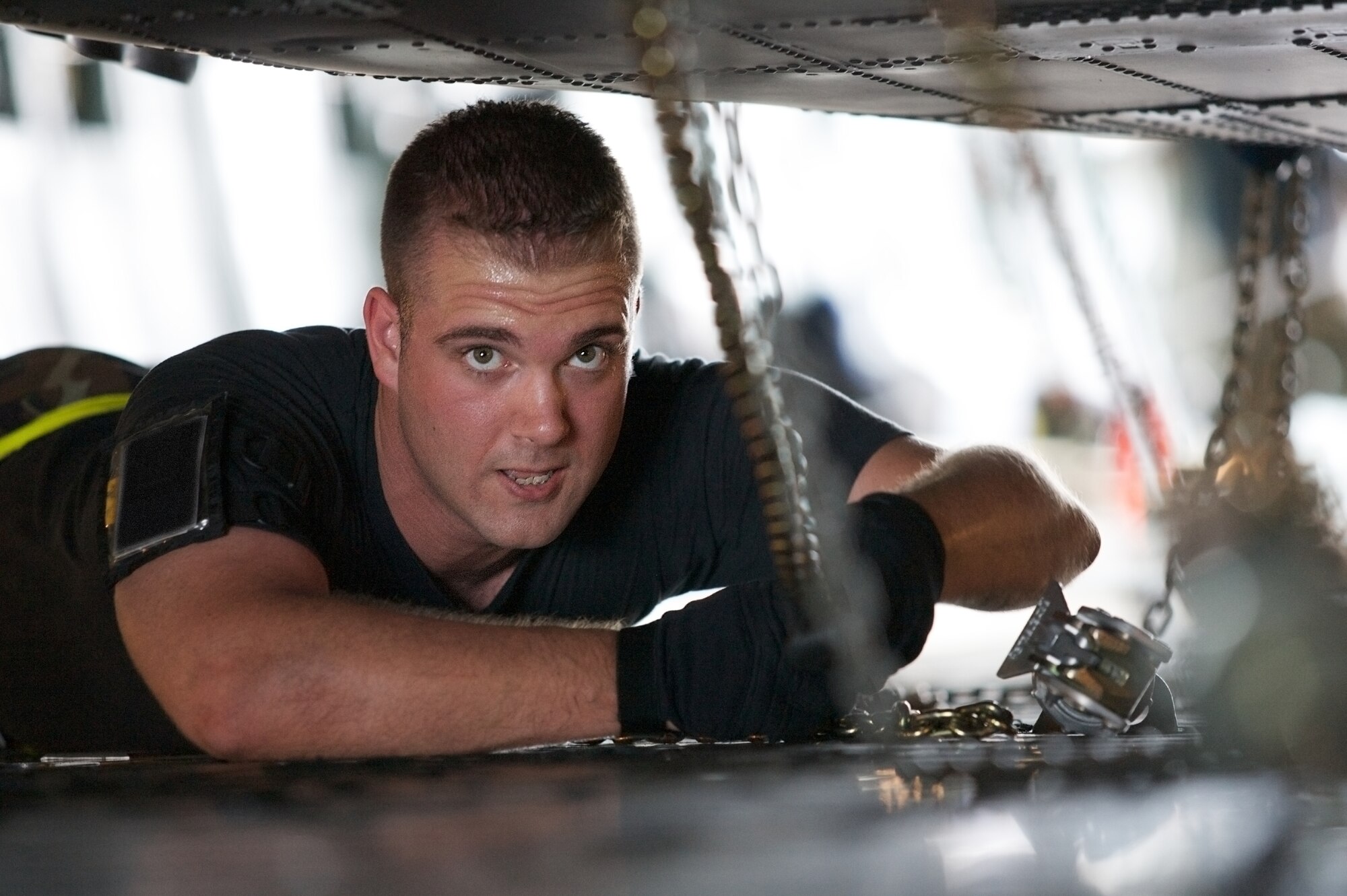CAPE CANAVERAL AIR FORCE STATION, Fla., -- Air Force Reservist Senior Airman David Shaw, 920th Maintenance Squadron, Patrick Air Force Base, Fla., secures one of two HH-60G Pave Hawk helicopters onto a C-5 Galaxy aircraft that will airlift the helicopters overseas for life saving operations in support Operaton Enduring Freedom.  Helicopter, maintenance and support personnel will mobilize to Afghanistan for approximately 7 months to providing aeromedical evacuation for injured personnel.  (U.S. Air Force Photo/Tech. Sgt. Jeremy Allen)