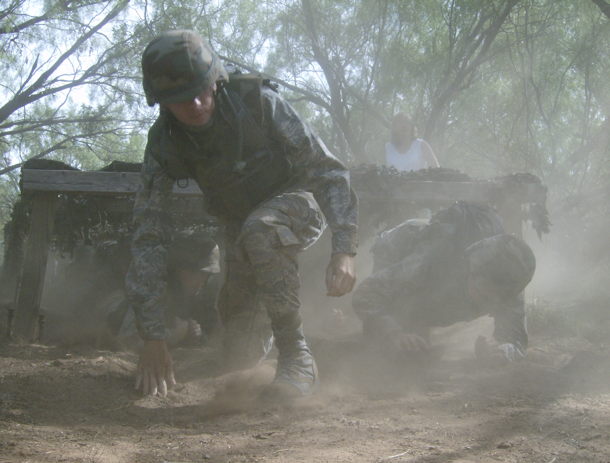 Airmen in Training from the 363rd Training Squadron make their way though an obstacle course Aug. 9 during a deployment exercise designed to increase their combat skills knowledge. The exercise goes along with 82nd Training Wing Commander Brig. Gen. O.G. Mannon's goal to produce combat-ready Airmen. (U.S. Air Force photo/Airman 1st Class James Bell)