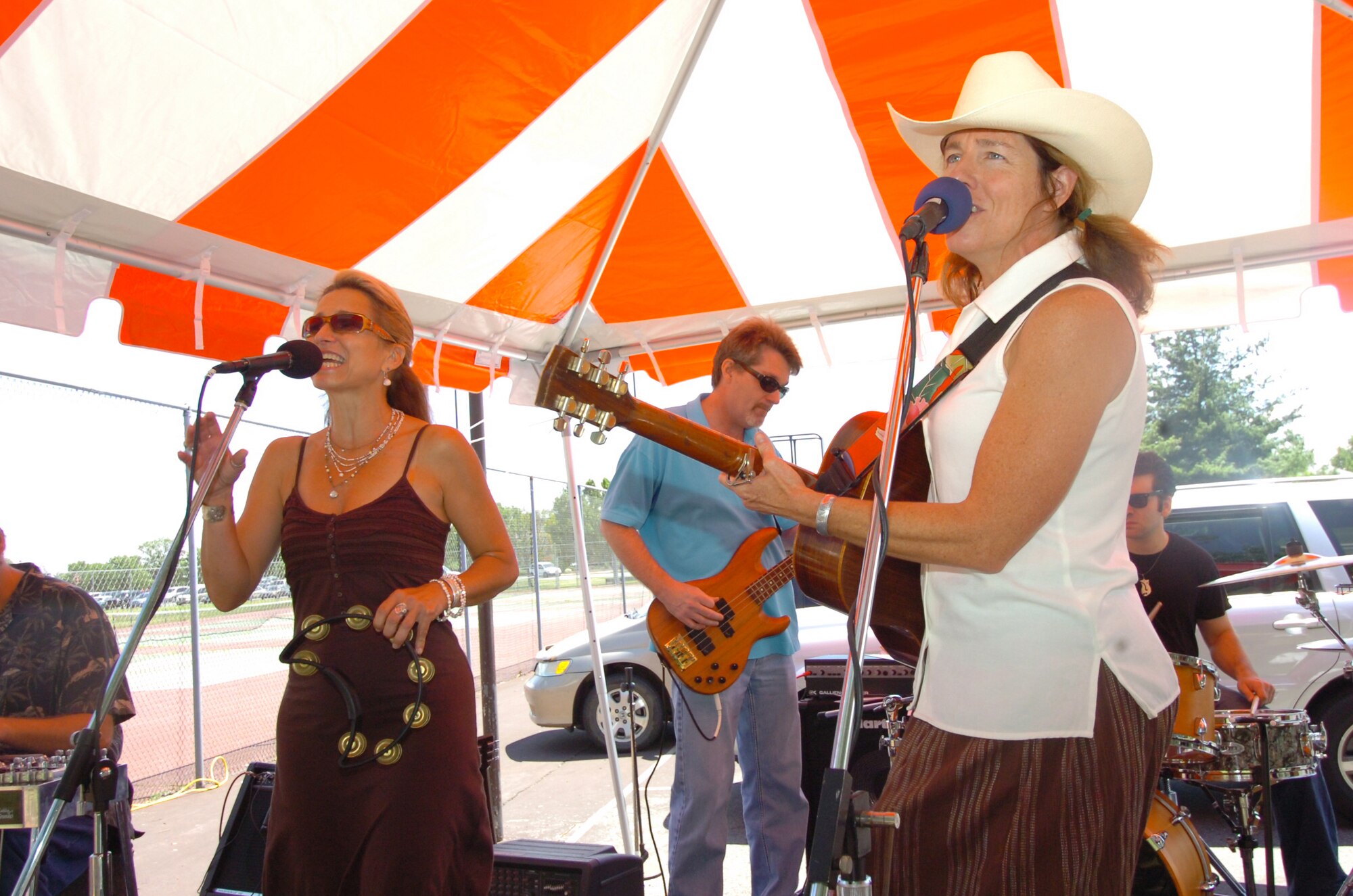 “One Horse Town,” a contemporary Country Western band, entertained the crowds during an outdoor concert on the tennis courts.  Hosted by the 316th Services Squadron, members were treated to free food, beverages and several fun activities. More than 4,000 military members, civilians and their families attended the day-long event. The annual event is held to thank base employees and their families.