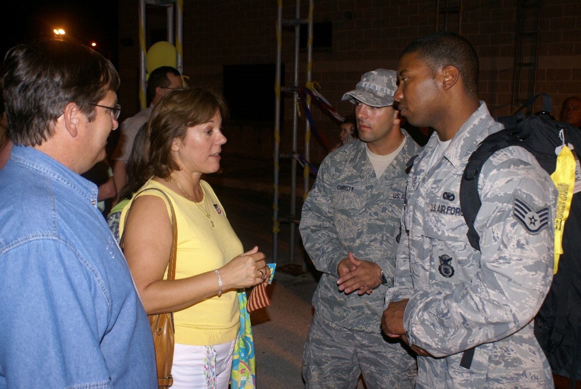 City of Homestead Councilman Tim Nelson (far left) and Mayor Lynda Bell greeted the reservists as they returned to Homestead Air Reserve Base after completing a six-month deployment to Kirkuk Regional Air Base, Iraq. The reservists maintained a safe and secure environment for thousands of U.S., Coalition and Iraqi troops, U.S. State Department Provisional Reconstruction Teams, and civilian contractors housed and operating from the base. (U.S. Air Force photo/Staff Sgt. Erik Hofmeyer)