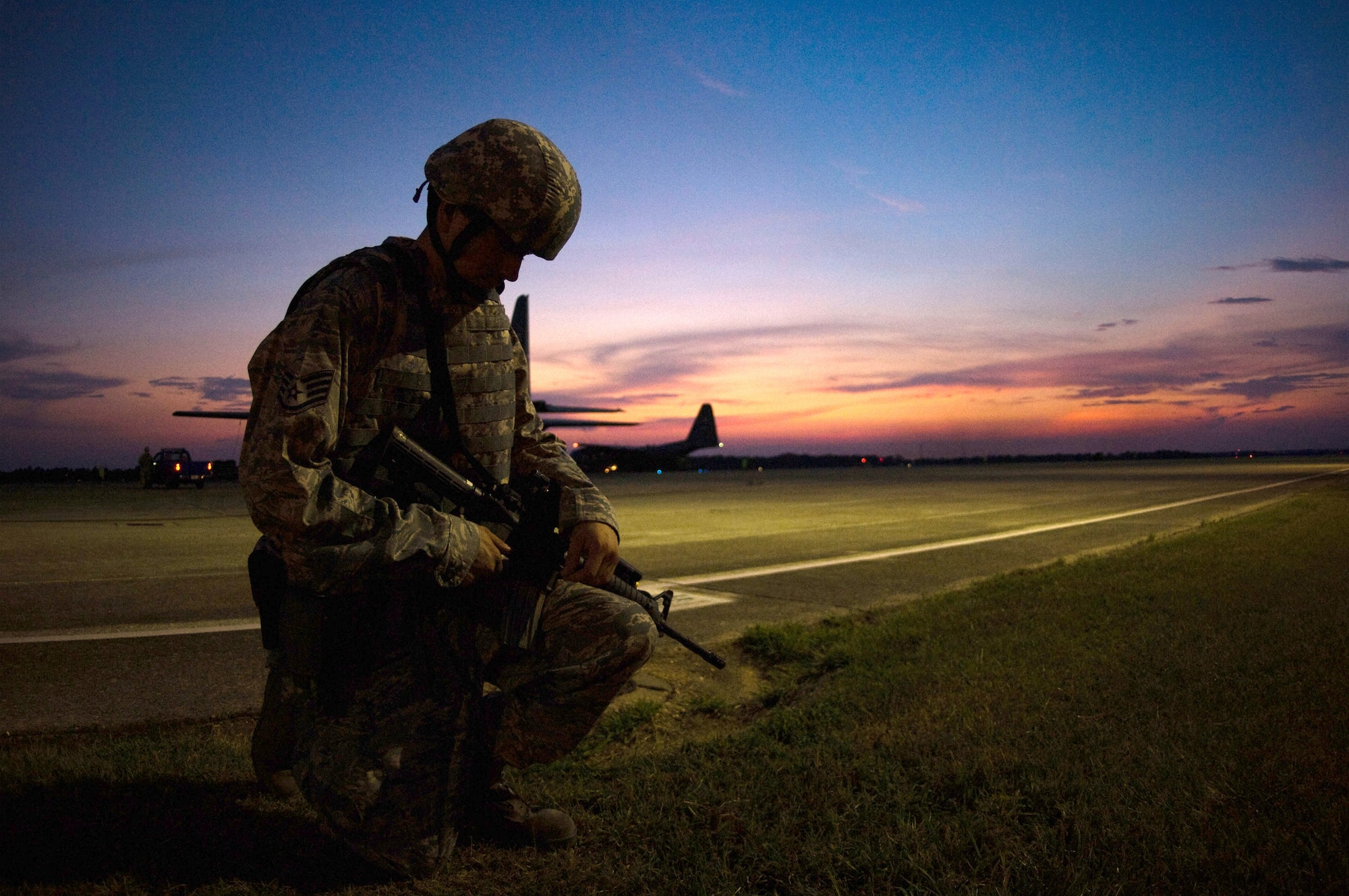 MAXWELL AIR FORCE BASE, Ala. -- An Airman takes a moment to reflect while on patrol near the flightline here Aug. 6. The patrol was part of a base-wide exercise preparing for a fall Operational Readiness Inspection.  (Air Force photo by Donna Burnett)