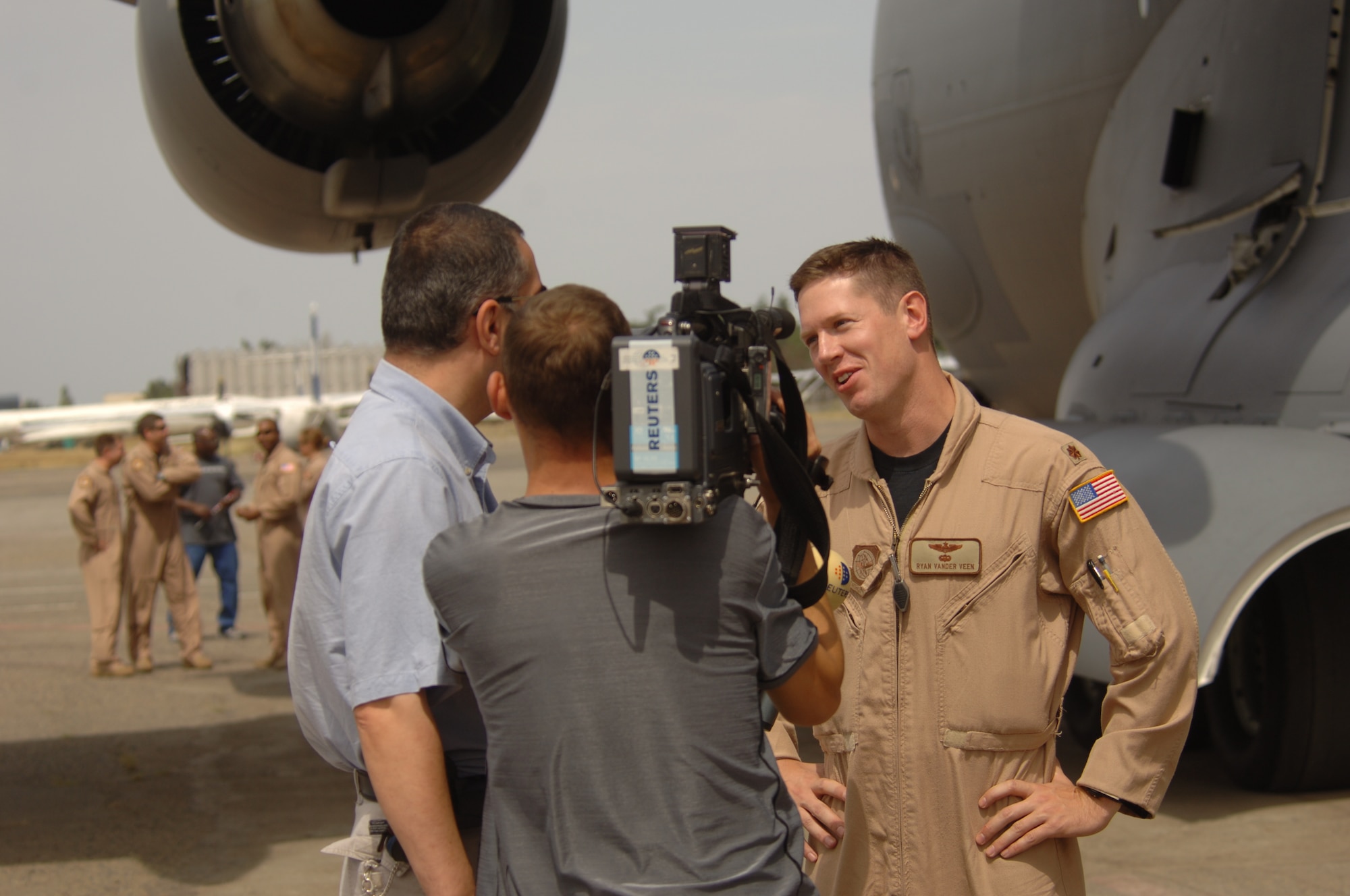 C-17 Globemaster III Pilot Maj. Ryan Vanderveen is interviewed by a Reuters News team shortly after arriving with the second delivery of U.S. donated humanitarian aid to a civilian airport in Tbilisi, Republic of Georgia, Aug. 14. The delivery was a joint-service effort between U.S. Army Europe Soldiers, U.S. Air Forces Europe and Air Mobility Command Airmen. Major Vanderveen is assigned to the 6th Airlift Squadron, McGuire AFB, N.J. (U.S. Air Force Photo/Master Sgt. Scott Wagers)