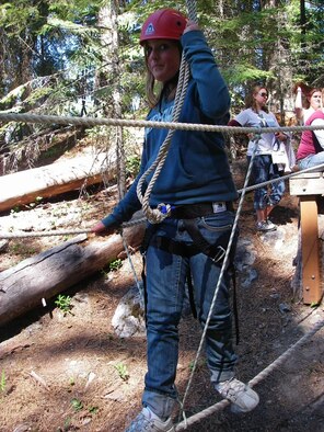 A camper navigates the ropes course during last year’s Operation Purple Camp at Camp Zanika Lache in Wenatchee, Wash.