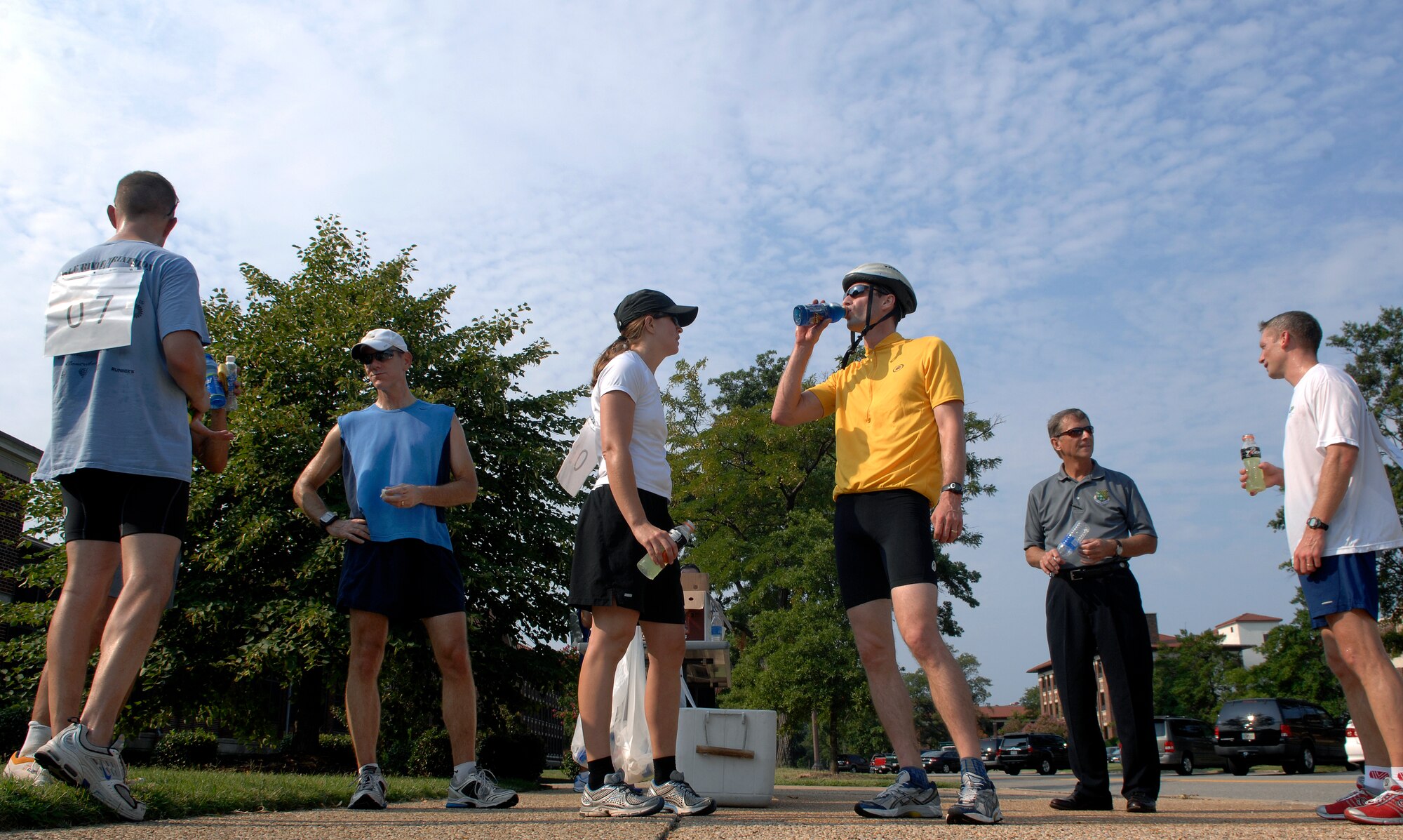 LANGLEY AIR FORCE BASE, Va. -- Participants gather around after completing an eight mile duathlon sponsored by the 1st Force Support Squadron Aug. 15.  The duathlon is designed to challenge each participant's physical endurance with cycling and running.  The 1st FSS organizes an event monthly to continue encouraging physical fitness as the Air Force exercises the fit to fight mentality.  (U.S. Air Force photo/Senior Airman Vernon Young)