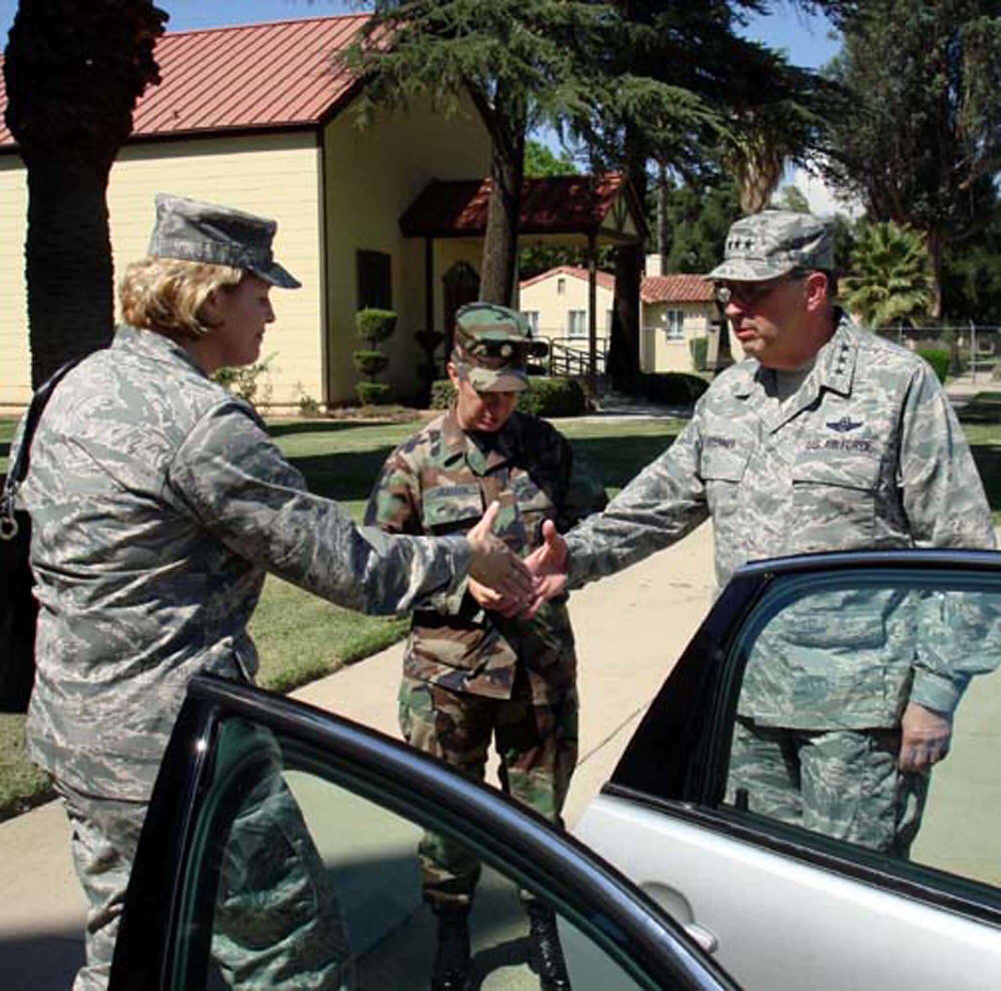 Lt. Gen. Charles E. Stenner Jr., Chief and Commander, Air Force Reserve Command, is introduced to Lt. Col. Lisa A. Yacoub, 452nd Mission Support Squadron Commander, at the general's  August 6, 2008 visit to March ARB, Calif., while  Maj. Maureen McAllen, Fourth Air Force Executive Officer stands by.