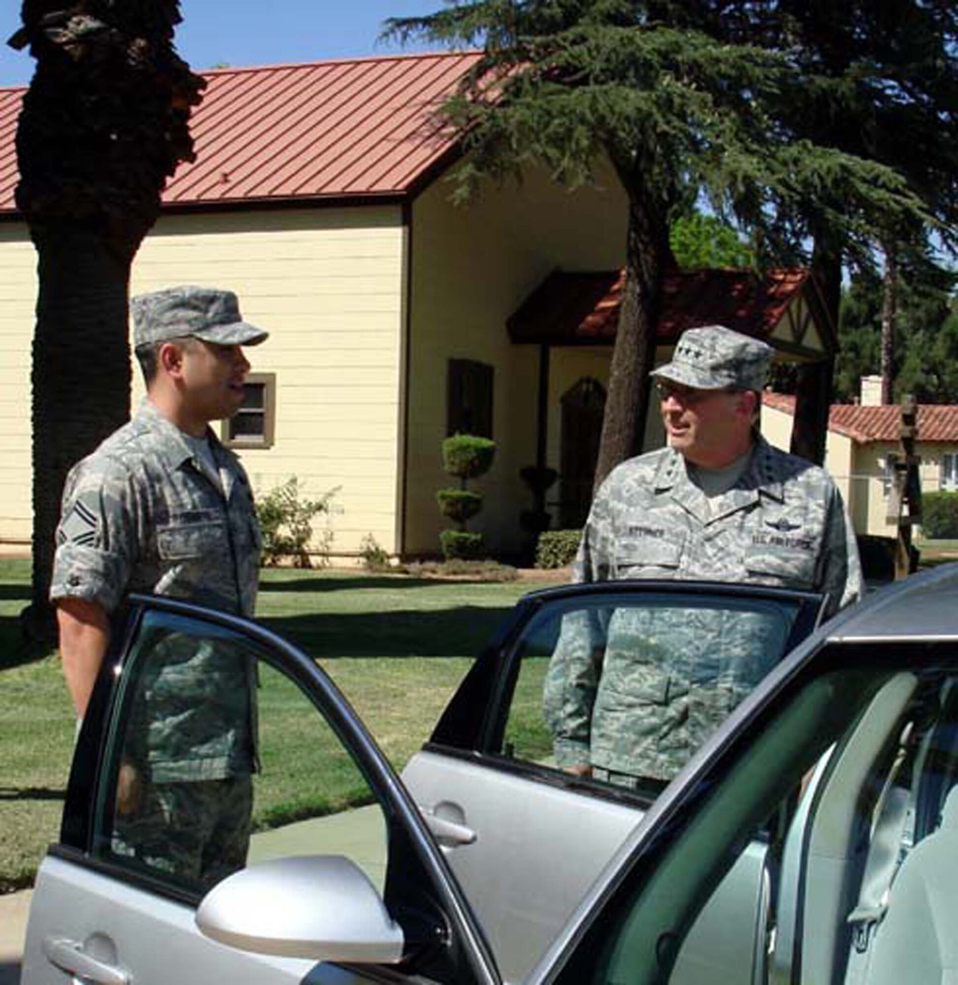 SMSgt. Marcel Rodarte, Fourth Air Force Honor Guard member answers questions about the all-volunteer group from Lt. Gen. Charles E. Stenner Jr., Chief and Commander, Air Force Reserve Command.  The general was at March ARB, Calif., August 6, 2008 to visit the numbered Air Force  headquarters.  (U.S. Air Force photo/MSgt. Linda E. Welz)