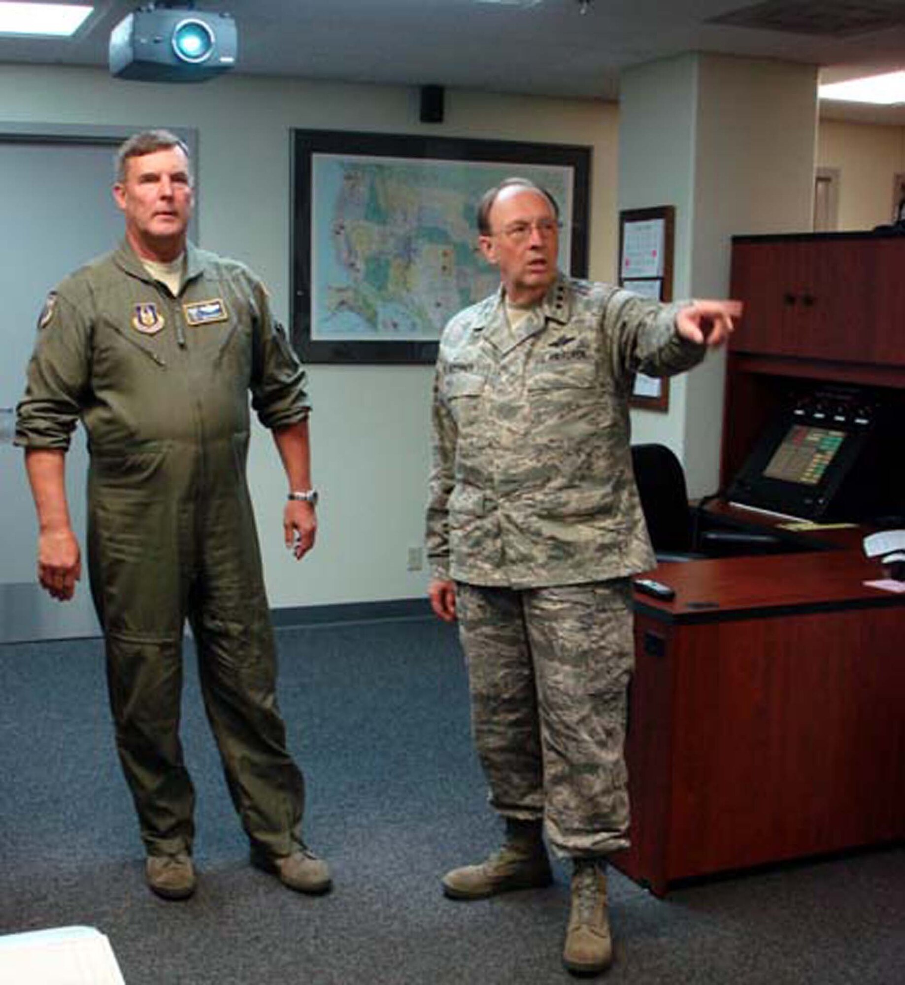 Lt. Gen. Charles E. Stenner Jr., Chief and Commander, Air Force Reserve Command, discusses command post operations with Maj. Gen. Robert E. Duignan, Fourth Air Force Commander, August 6, 2008, during a visit to the numbered Air Force located at March ARB, Calif.  (U.S. Air Force photo/MSgt. Lnda E. Welz)