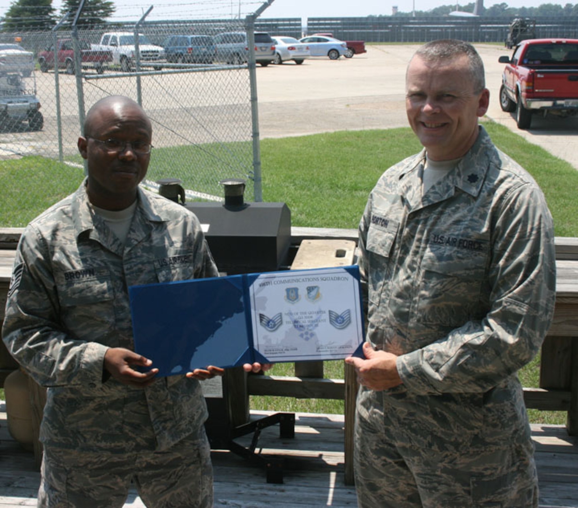 SEYMOUR JOHNSON AIR FORCE BASE, N.C. -- Tech. Sgt. TJ Brown, a communications computer operator helper with the 916th Communications Squadron, was recognized as Non-Commissioned Officer of the Quarter by his commander, Lt. Col. James Horton. Both are reservists with the 916th Air Refueling Wing.