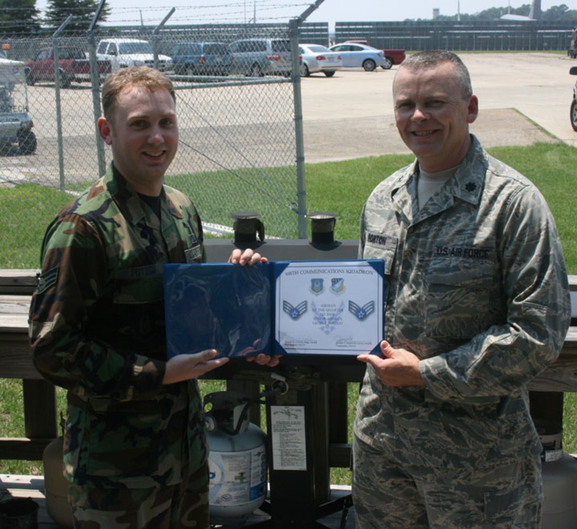 SEYMOUR JOHNSON AIR FORCE BASE, N.C. -- Senior Airman George Potzgo, an information manager with the 916th Communications Squadron, was recognized as Airman of the Quarter by his commander, Lt. Col. James Horton. Both are reservists with the 916th Air Refueling Wing.