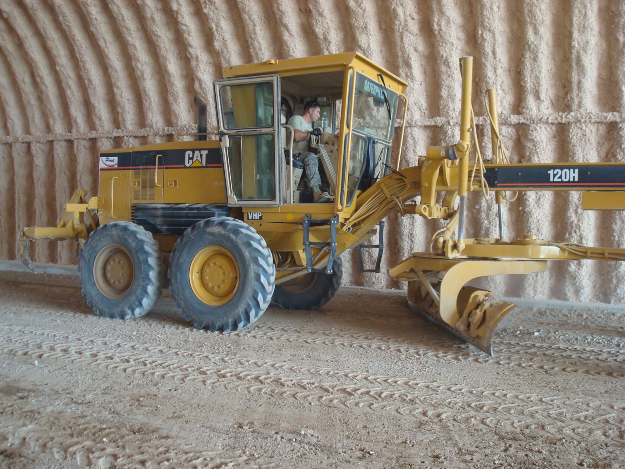 SEYMOUR JOHNSON AIR FORCE BASE, N.C. -- Senior Airman John Long, an equipment supervisor with the 916th Civil Engineer Squadron, prepares the ground for concrete while deployed to Balad Air Base, Iraq. Airman Long is one of many Reserve engineers deployed to the area from the 916th Air Refueling Wing.