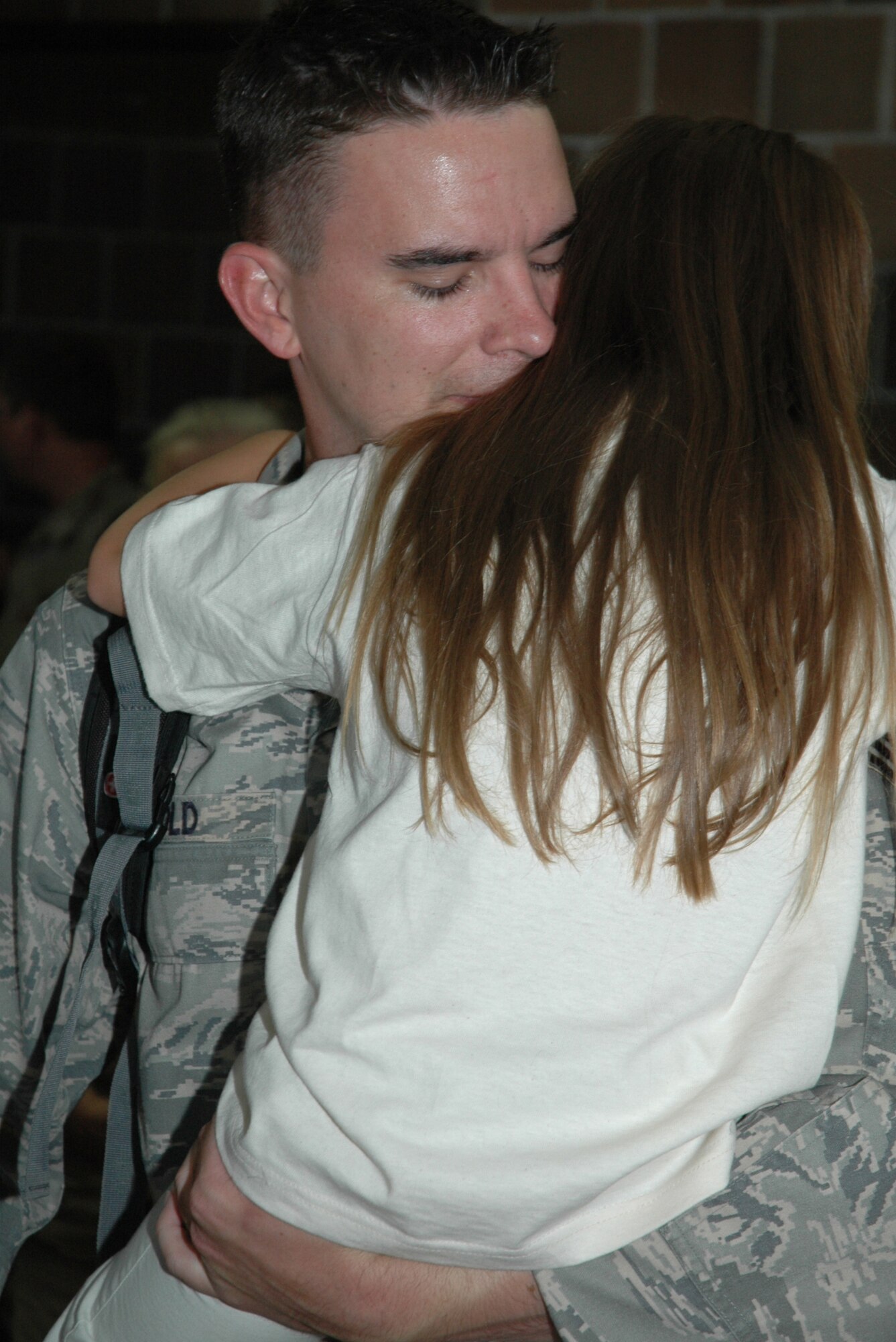 Senior Airman Joseph Arnold, a reservist with the 315th Security Forces Squadron,  greets his daughter upon returning form a six month deployment in Iraq.  Thirteen Airmen from the 315th Airlift Wing’s Security Forces Squadron returned to Charleston yesterday after more than six months at Kirkuk Air Base, Iraq. (U.S. Air Force photo/Tanya Trejo)