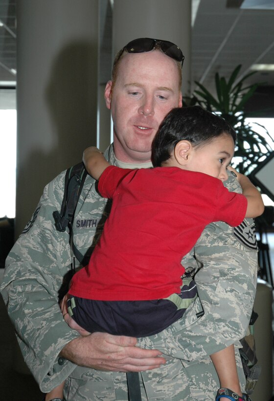 Tech. Sgt. Steven Smith, a reservist with the 315th Security Forces Squadron, gives his son a big hug after returning from a six month deployment. Thirteen Airmen from the 315th Airlift Wing’s Security Forces Squadron returned to Charleston yesterday after more than six months at Kirkuk Air Base Iraq. (U.S. Air Force photo/Tanya Trejo)