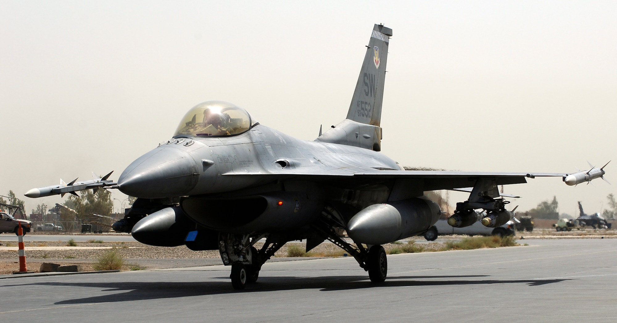 JOINT BASE BALAD, Iraq -- An F-16 Fighting Falcon piloted by Capt. Michael Lutmer and loaded with 500-pound GBU-54 Laser Joint Direct Attack Munitions taxies toward a runway here Aug. 15. Two F-16 pilots with the 77th Expeditionary Fighter Squadron here executed the first-ever combat employment of a GBU-54 Aug. 12 against a moving enemy vehicle in Diyala province to support a combined Iraqi army and U.S. Marine operation. Captain Lutmer, a pilot with the 77th EFS, is deployed from Shaw Air Force Base, S.C. (U.S. Air Force photo/Staff Sgt. Don Branum)