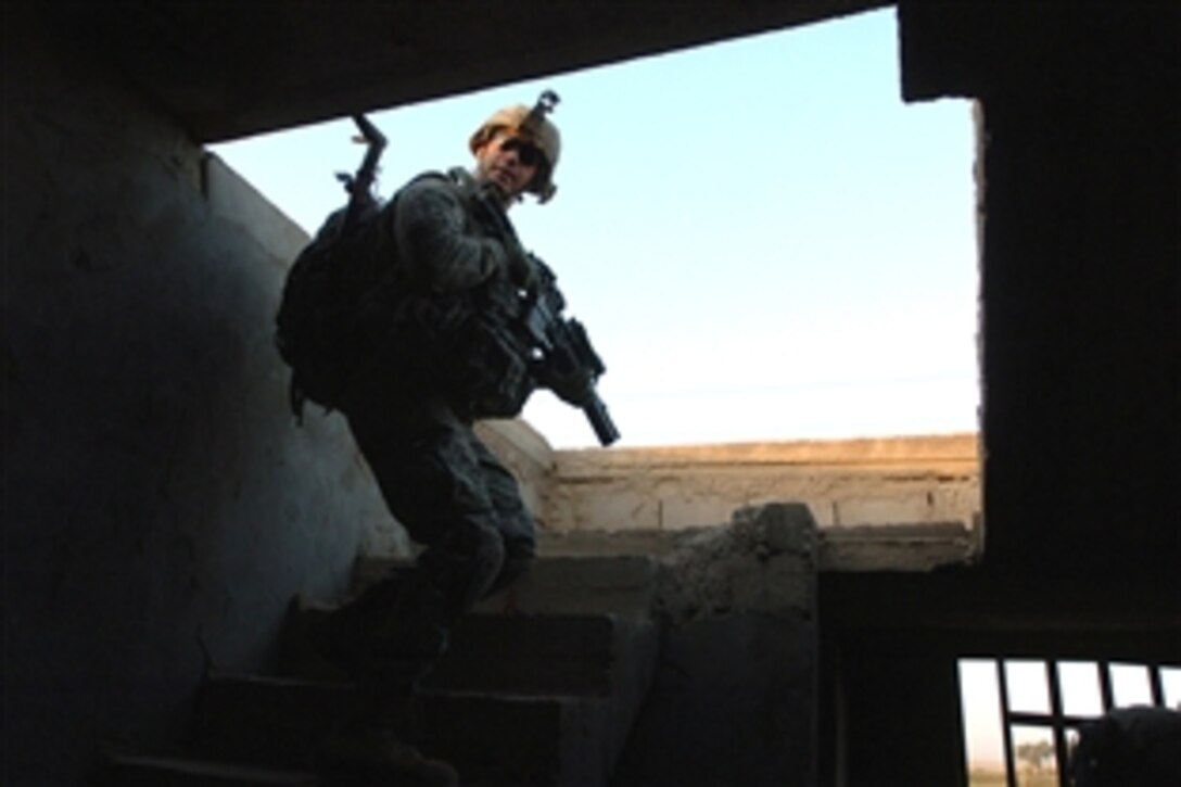 A U.S Army soldier clears a house during operation Kips Bay, a combined air assault operation in Al Betra, about 30 kilometers southwest of Baghdad, Iraq, Aug. 8, 2008. The soldier is assigned to 101st Airborne Division's Company A, 3-187th Infantry, 3rd Brigade Combat Team.