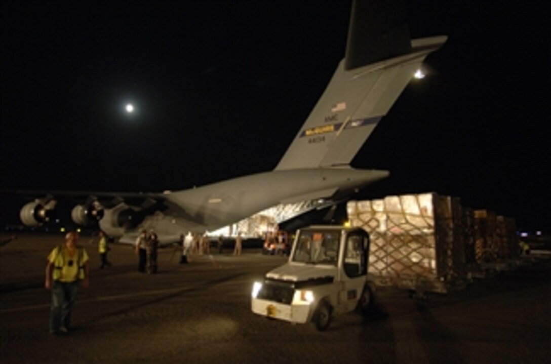 A C-17 Globemaster III aircraft delivers 16 pallets containing $1 million worth of U.S. donated medical supplies, blankets, sleeping bags and bed sheets to Tbilisi, Georgia, on Aug. 13, 2008.  The pallets are part of the first wave of humanitarian supplies being delivered to Georgian citizens.  U.S. airmen and soldiers worked 36 hours to palletize more than 75,000 pounds of emergency shelter items and medical supplies.  