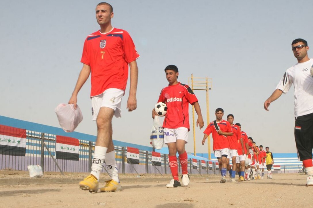 RAMADI, Iraq (August 15, 2008) - Iraqi soccer players line up before a game during the Ramadi Soccer Tournament at the Mulaab Soccer Stadium August 10.  (Official U.S. Marine Corps photo by Lance Cpl. Casey Jones) (RELEASED)
