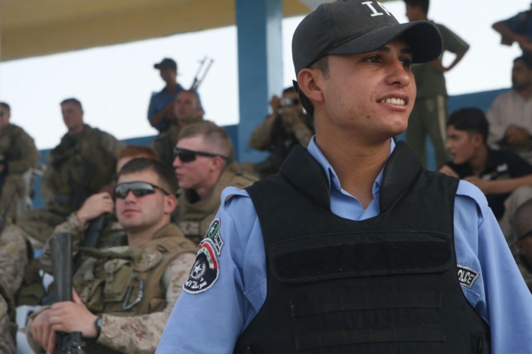 RAMADI, Iraq (August 15, 2008) - An Iraqi Policeman provides security during the Ramadi Soccer Tournament at the Mulaab Stadium August 14. The Iraqi Police took the lead on providing security and ensuring the event went off without a hitch. The Marines with 1st Battalion, 9th Marine Regiment, Regimental Combat Team 1, served primarily in an overwatch role for the event. “The Iraqi Police did a great job posting security for the tournament,” said 1st Lt. Patrick J. Skehan, a platoon commander with 81mm Mortars Platoon, Weapons Company. “The Iraqi Police have learned that with every new battalion that comes to the city, the expectations for the police will increase. I think, they’ve meet those expectations.” (Official U.S. Marine Corps photo by Lance Cpl. Casey Jones) (RELEASED)
