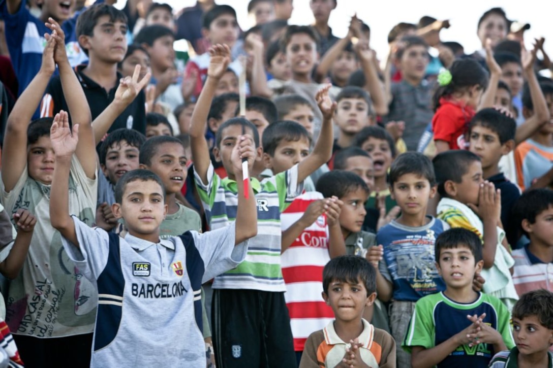 RAMADI, Iraq (August 15, 2008) – Children cheer after a goal for their favorite team during the Ramadi Soccer Tournament at the Mulaab Stadium August 14. In addition to bringing the city together, the continued use of the stadium will give the city’s youth an extracurricular activity to keep them occupied. “This stadium will give the children an alternative to being on the streets,” said Lt. Col. Brett A. Bourne, the battalion commander for 1st Battalion, 9th Marine Regiment, Regimental Combat Team 1. “It will give the students somewhere positive to channel their energy.” (Official U.S. Marine Corps photo by Sgt. Jeremy M. Giacomino) (RELEASED)
