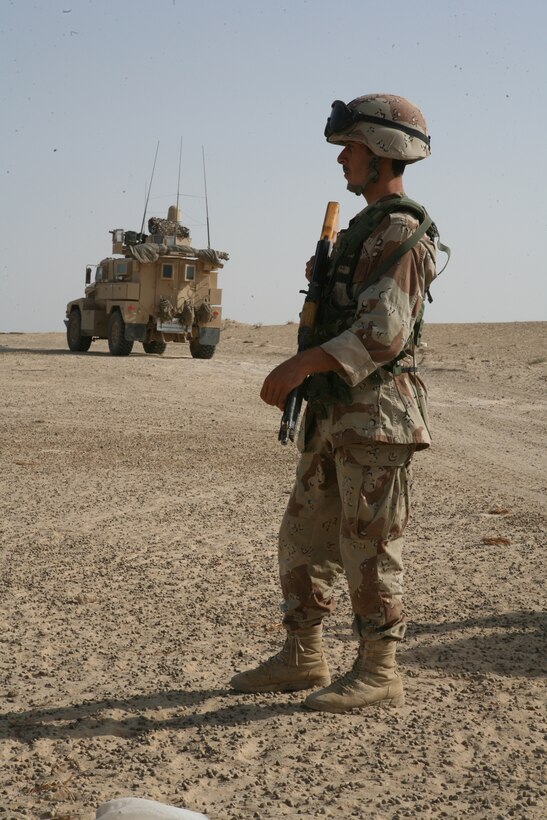 SADAMIYAH PENINSULA, Iraq (August 14, 2008) – An Iraqi soldier with 1st Battalion, 2nd Brigade, 1st Iraqi Army Division, patrols during a 72-hour sweep operation Aug. 15.  At the request of Iraqi leaders, Marines with Company A, 1st Battalion, 2nd Marine Regiment, Regimental Combat Team 1, provided assistance for the Iraqi-led operation. (Official U.S. Marine Corps photo by Lance Cpl. Scott Schmidt)