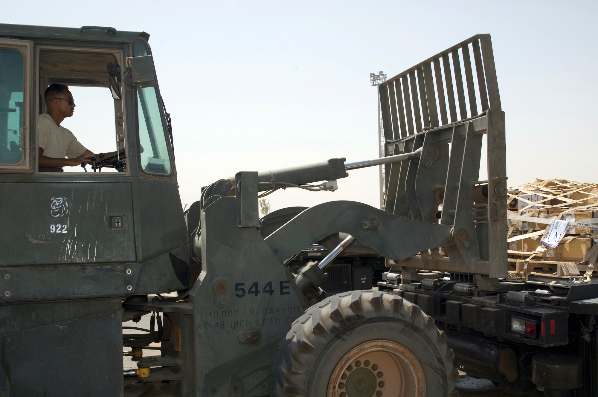JOINT BASE BALAD, Iraq ? Airman 1st Class Shane Costa drives a forklift unloading pallets from a K-loader here Aug. 16. Airman Costa, a reservist with the 332nd Expeditionary Logistics Readiness Squadron here, completed a new Air Force Reserve "seasoning training" program that allows Airmen to reach journeyman skill level in their Air Force specialties in just three months instead of 14 to 16 months by voluntarily staying on active duty. He is deployed from the 48th Aerial Port Squadron at Hickam Air Force Base, Hawaii. (U.S. Air Force photo/Tech Sgt Erik Gudmundson)