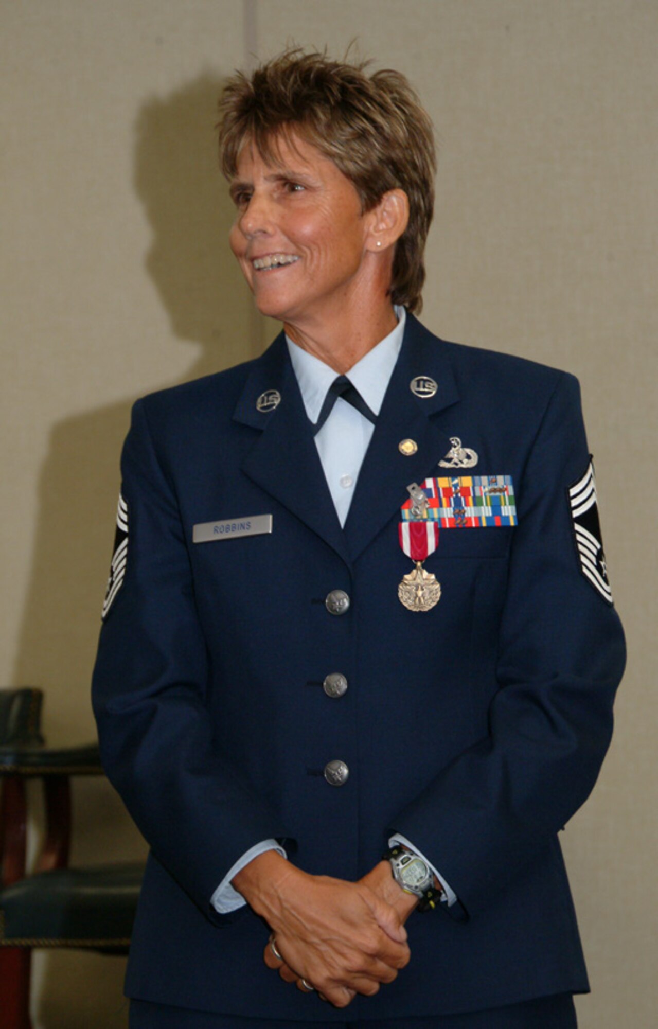Newly retired Chief Master Sgt. June Robbins, speaks to a crowd of friends and co-workers after her retirement ceremony Aug. 15 at Eglin Air Force Base, Fla.  The chief ended her 30-year career as the 53d Test Management Group's top enlisted.  Photo by Staff Sgt. Samuel King Jr.
